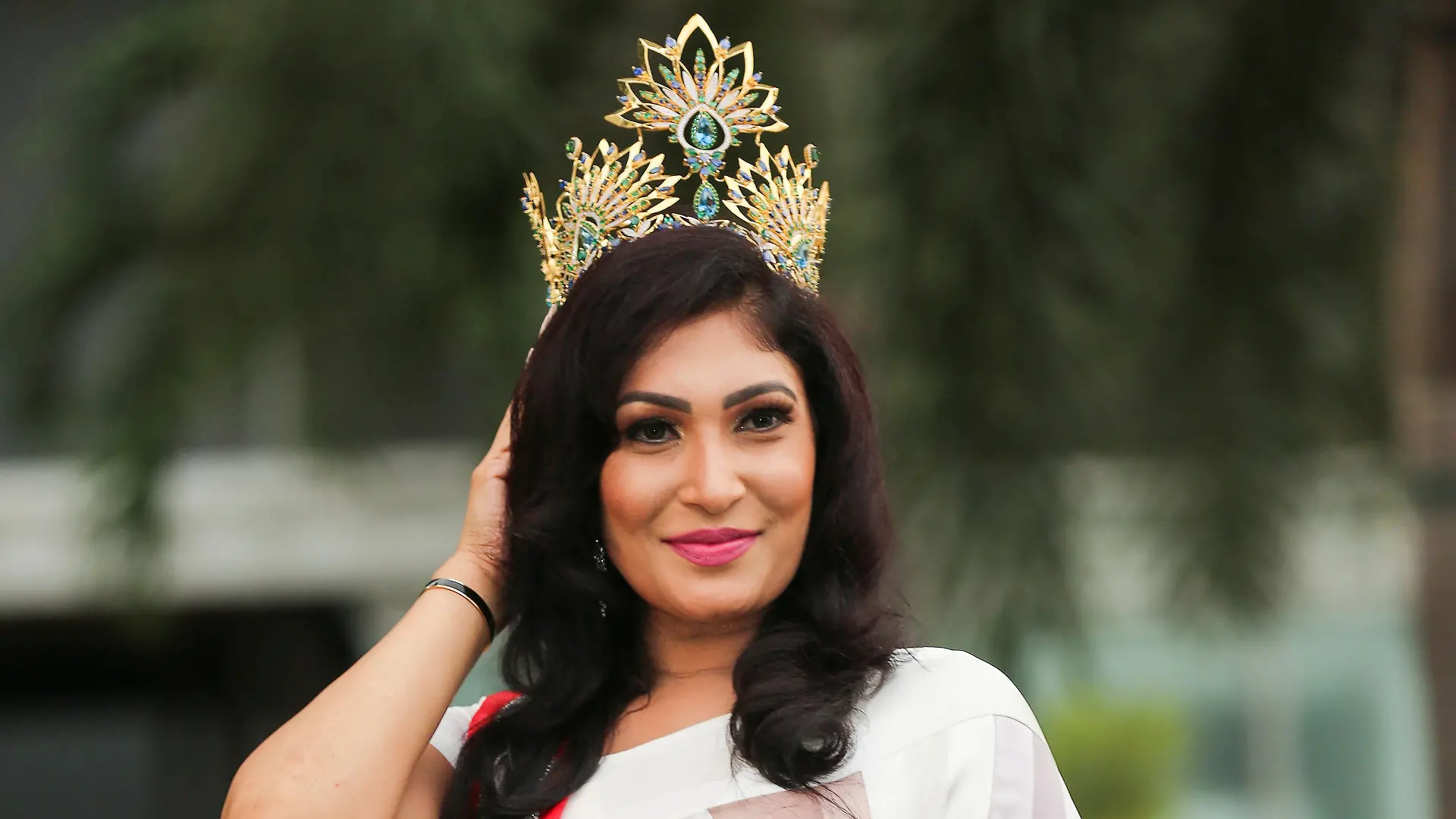Pushpika De Silva poses for photographs with her Mrs Sri Lanka crown after it was forcibly removed by the reigning Mrs World, Caroline Jurie at the Mrs Sri Lanka contest, in Colombo, Sri Lanka, April 6, 2021. Picture taken April 6, 2021. REUTERS/Stringer