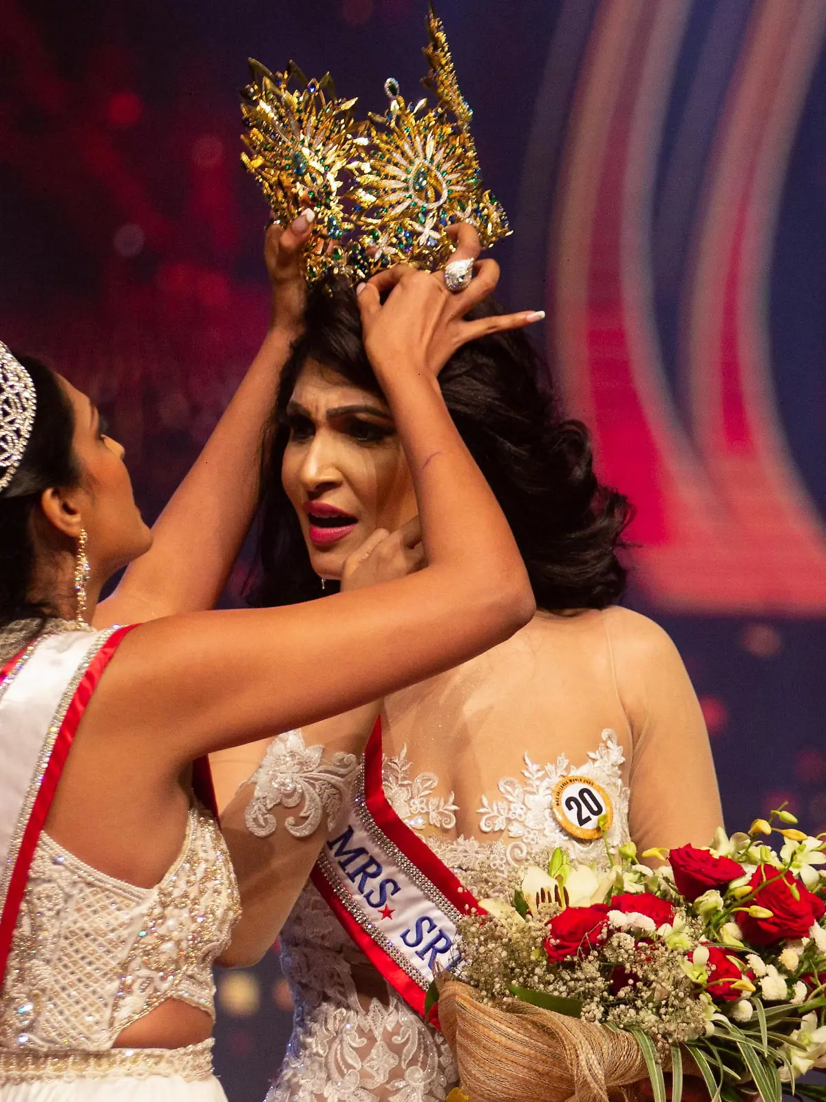 Reigning Mrs World Caroline Jurie, forcibly removes the Mrs Sri Lanka winner Pushpika De Silva's crown as Jurie declared that the winner was ineligible because she was divorced, during the Mrs Sri Lanka pageant, in Colombo, Sri Lanka April 4, 2021. Picture taken April 4, 2021. REUTERS/Gimhana Pathirana