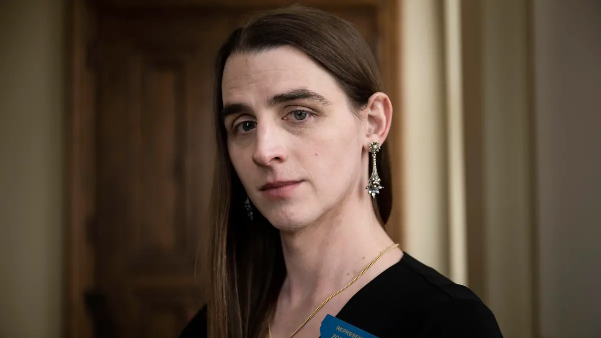 FILE - Rep. Zooey Zephyr poses for a photo at the Montana State Capitol in Helena, Mont., on Wednesday, April 26, 2023. The silencing of Zephyr, a transgender lawmaker in Montana, marks the third time in a month that Republicans have attempted to compare disruptive but otherwise peaceful protests at state capitols to insurrections. The tactic follows a pattern set over the past two years when the term has been misused to describe public demonstrations and even the 2020 election that put Democrat Joe Biden in the White House. (AP Photo/Tommy Martino, File)