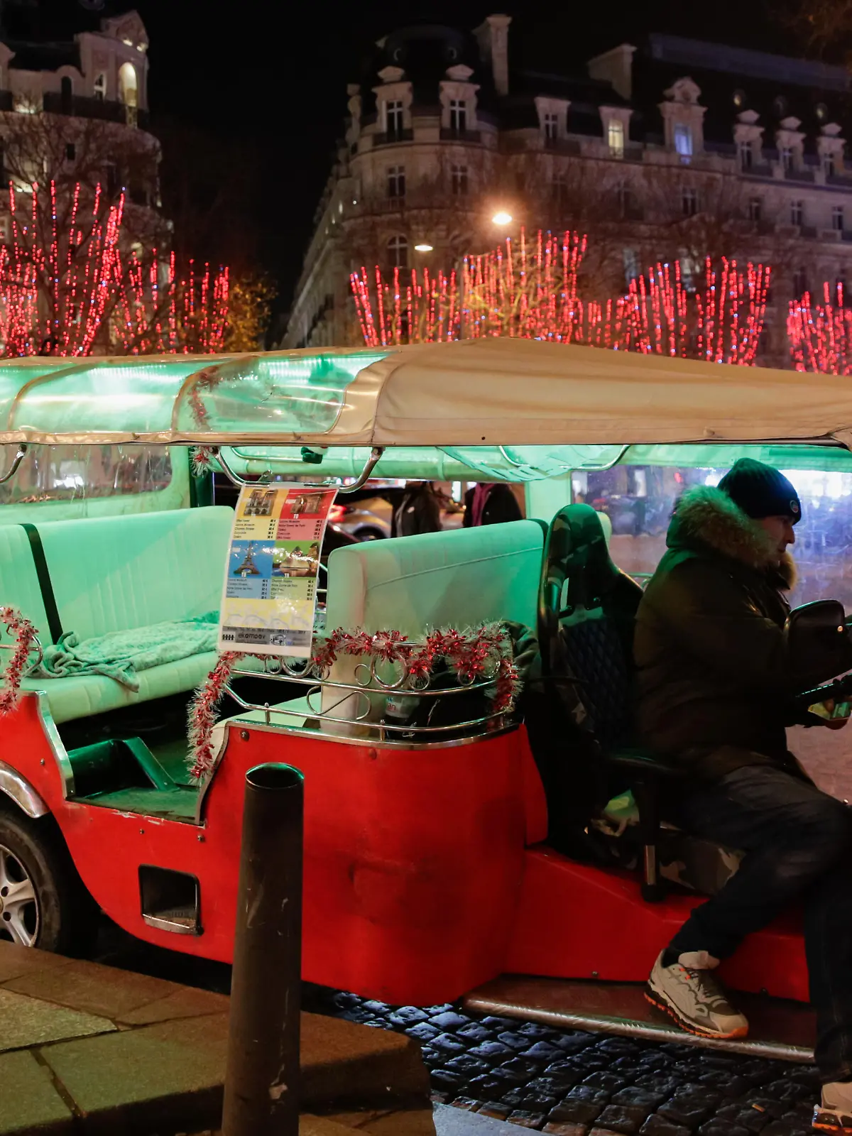 PARIS, FRANCE - DECEMBER 22: Trees covered by spotlights for Christmas are seen at the Champs-Elysees Avenue in Paris, France on December 22, 2021. Geoffroy Van der Hasselt / Anadolu Agency