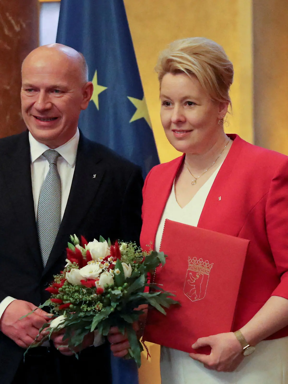 FILE PHOTO: Newly elected Mayor of Berlin Kai Wegner and his predecessor and designated Berlin Senator for Economics and Energy Franziska Giffey look on at the city's town hall Rotes Rathaus (Red Townhall), in Berlin, Germany, April 27, 2023. REUTERS/Nadja Wohlleben/File Photo