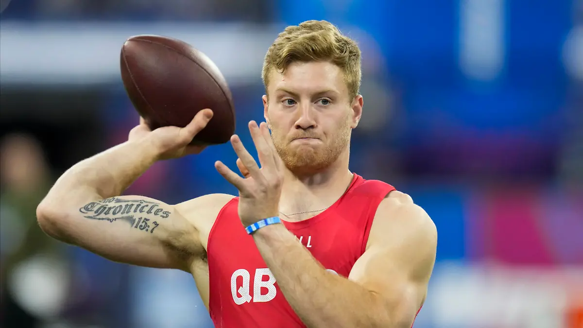 Kentucky quarterback Will Levis warms up before he runs a drill at the NFL football scouting combine in Indianapolis, Saturday, March 4, 2023. (AP Photo/Michael Conroy)