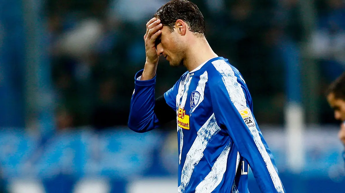 BOCHUM, GERMANY - NOVEMBER 07:  Diego F. Klimowicz and Mimoun Azaouagh walk off dejected during the Bundesliga match between VfL Bochum and SC Freiburg at the Rewirpower Stadium on November 07, 2009 in Bochum, Germany.  (Photo by Friedemann Vogel/Bongarts/Getty Images)