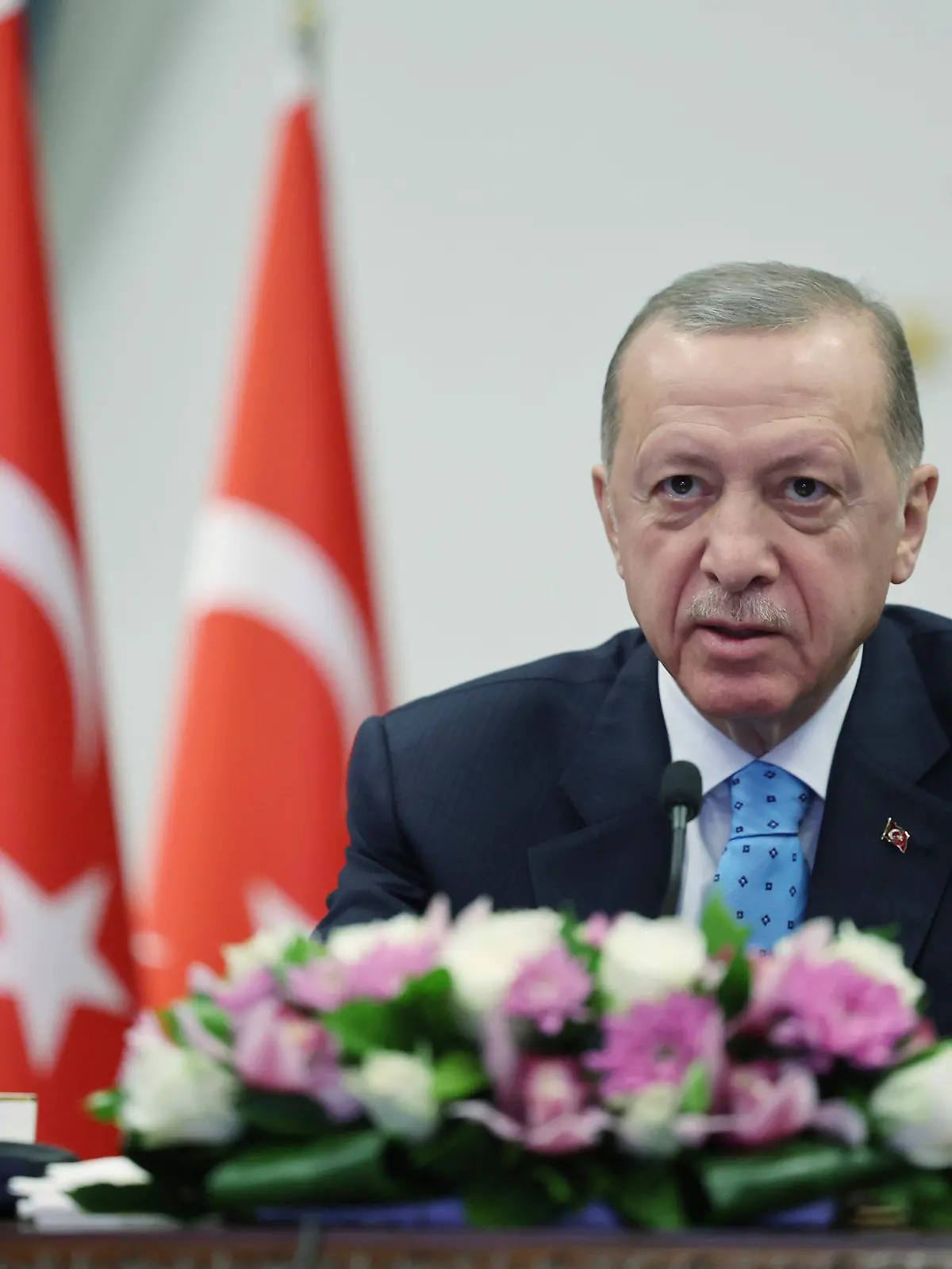 In this handout photo released by Turkish Presidency, Turkey's President Recep Tayyip Erdogan inaugurates Turkey's first nuclear power plant via a video link, at the Presidential palace in Ankara, Thursday, April 27, 2023. Sitting behind a desk surrounded by Cabinet members, aides and political allies, the 69-year-old leader remotely presided over the event marking the delivery of the first fuel to Russian-built Akkuyu Nuclear Power Plant, in southern Turkey. (Turkish Presidency via AP)