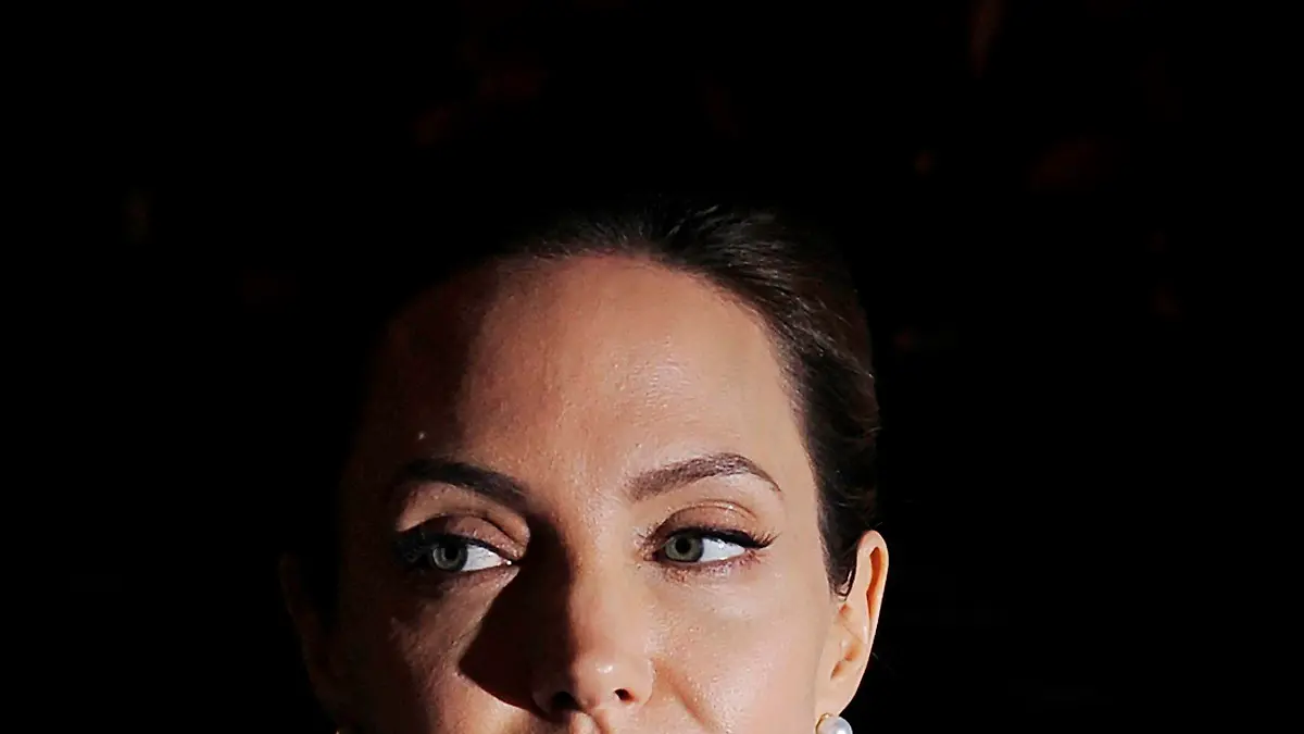 epa05549315 (FILE) The file picture dated 13 June 2014 shows US actress Angelina Jolie (L) and US actor Brad Pitt (R) arriving for the Global Summit to End Sexual Violence in Conflict at the Excel Center in London, Britain. According to media reports from 20 September 2016, Angelina Jolie filed for divorce from her husband Brad Pitt, as her lawyer confirmed. EPA/FACUNDO ARRIZABALAGA *** Local Caption *** 51415623 +++(c) dpa - Bildfunk+++