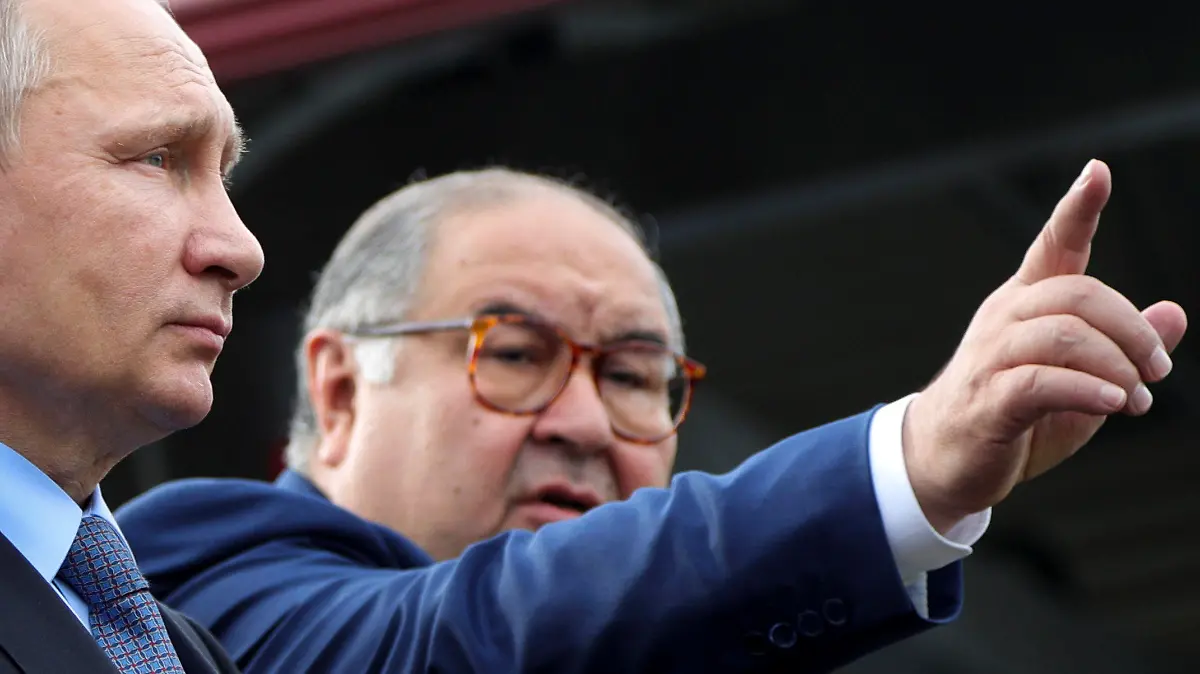 FILE - Russian businessman and founder of USM Holdings, Alisher Usmanov, points while speaking to Russian President Vladimir Putin, left, at the Lebedinsky GOK JSC, in Gubkin, Belgorod Region, Russia, July 14, 2017. The U.S. Treasury Department on April 12, 2023, announced new sanctions aimed at Usmanov, targeting the financial network of one of Russia's wealthiest businessmen. (Mikhail Klimentyev, Sputnik, Kremlin Pool Photo via AP)