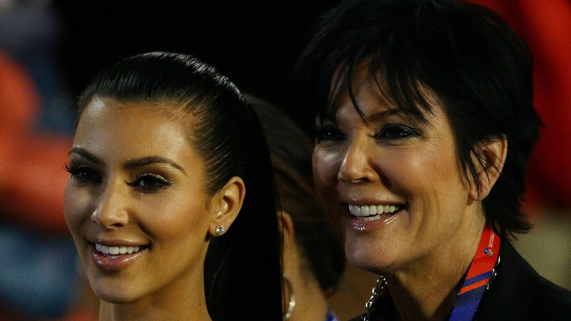MIAMI GARDENS, FL - FEBRUARY 07:  TV personalities Kim Kardashian and Kris Jenner celebrate on the field after Super Bowl XLIV between the Indianapolis Colts and the New Orleans Saints on February 7, 2010 at Sun Life Stadium in Miami Gardens, Florida.  (Photo by Win McNamee/Getty Images)