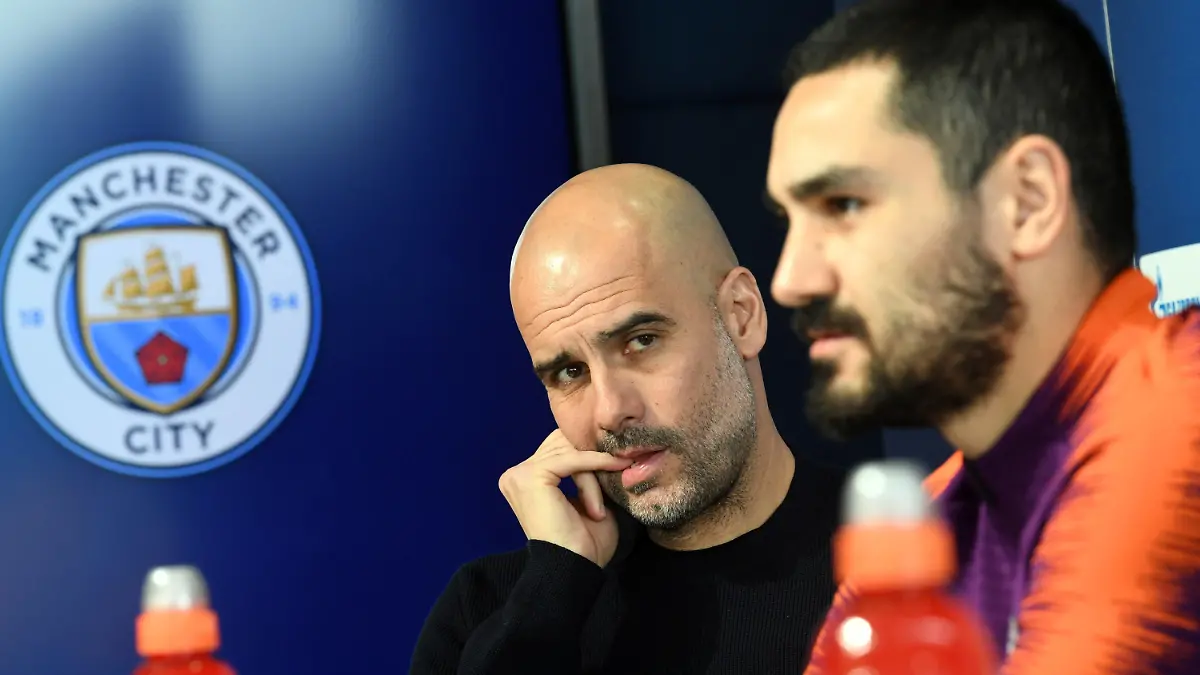 11.03.2019, Großbritannien, Manchester: Fußball: Champions League, vor dem Achtelfinal-Rückspiel Manchester City. Pressekonferenz mit Trainer Pep Guardiola und Ilkay Gündogan (r) von Manchester City im Etihad Stadion. Foto: Ina Fassbender/dpa +++ dpa-Bildfunk +++
