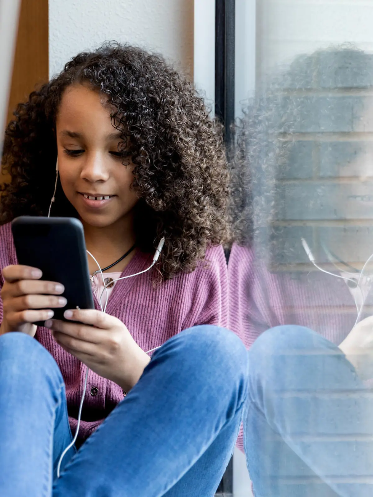 Kind mit Smartphone