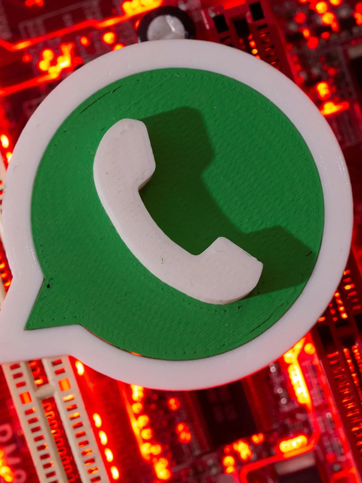 FILE PHOTO: A 3D printed Whatsapp logo is placed on a computer motherboard in this illustration taken January 21, 2021. REUTERS/Dado Ruvic/Illustration/File Photo