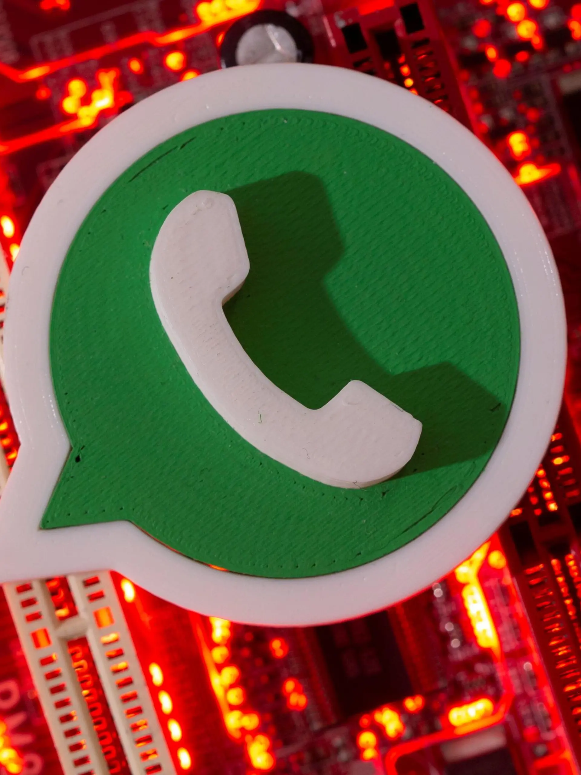 FILE PHOTO: A 3D printed Whatsapp logo is placed on a computer motherboard in this illustration taken January 21, 2021. REUTERS/Dado Ruvic/Illustration/File Photo