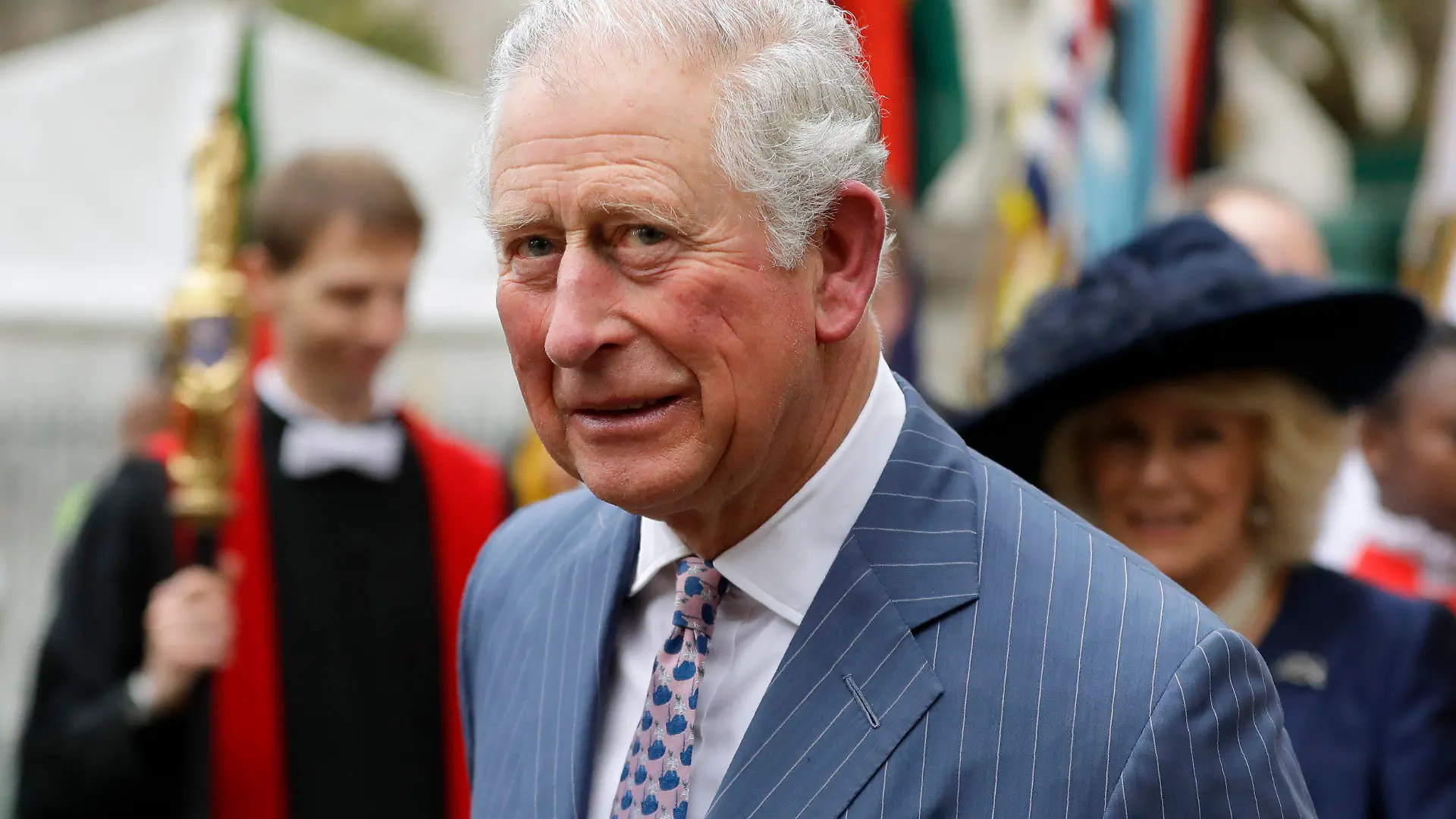 FILE - In this Monday, March 9, 2020 file photo, Britain's Prince Charles and Camilla the Duchess of Cornwall, in the background, leave after attending the annual Commonwealth Day service at Westminster Abbey in London. Prince Charles celebrated his 72nd birthday, on Saturday, Nov. 14, 2020, marking an eventful year that saw him contract the coronavirus and his son Prince Harry step down from official royal duties. Gun salutes would normally be fired from London’s Green Park and the Tower of London to mark the heir to the throne’s birthday, but officials said the ceremonies won’t take place this year due to COVID-19 restrictions. Charles’ eldest son Prince William and his wife, Kate, were among those wishing him a happy birthday on social media. (AP Photo/Kirsty Wigglesworth, File)