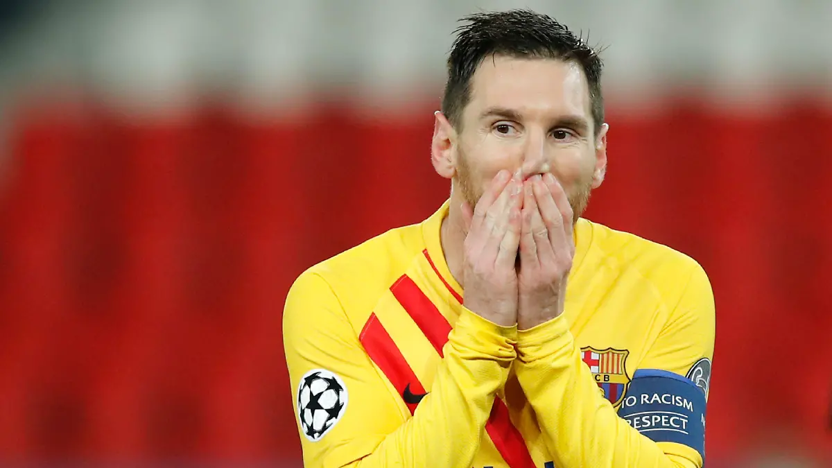 FILE - In this Wednesday, March 10, 2021 file photo Barcelona's Lionel Messi reacts after a missed a penalty shot during the Champions League, round of 16, second leg soccer match between Paris Saint-Germain and FC Barcelona at the Parc des Princes stadium in Paris. Neither Lionel Messi nor Cristiano Ronaldo will be in the Champions League quarterfinals for the first time since 2005. The two greatest players of the current generation were both eliminated from the competition this week. Messi scored a goal but missed a penalty as Barcelona was eliminated by Paris Saint-Germain. Ronaldo and his Juventus teammates were ousted by Porto the night before. Ronaldo has won five Champions League titles in his career. Messi has won four. (AP Photo/Christophe Ena, File)