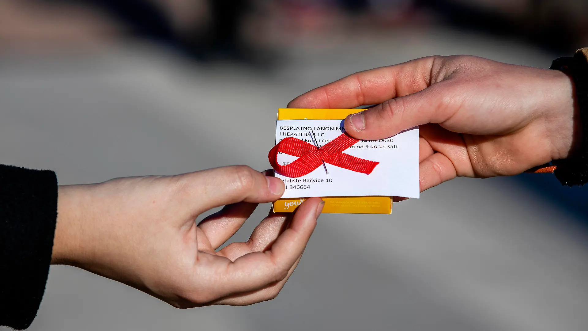 PXL_World AIDS Day On the occasion of the World AIDS Day, volunteers from the Youth Aid Association HELP shared red ribbons and condoms and also educated citizens about the importance of HIV testing, in Split, Croatia ,on Dec 01, 2020. MiroslavxLelas/PIXSELL