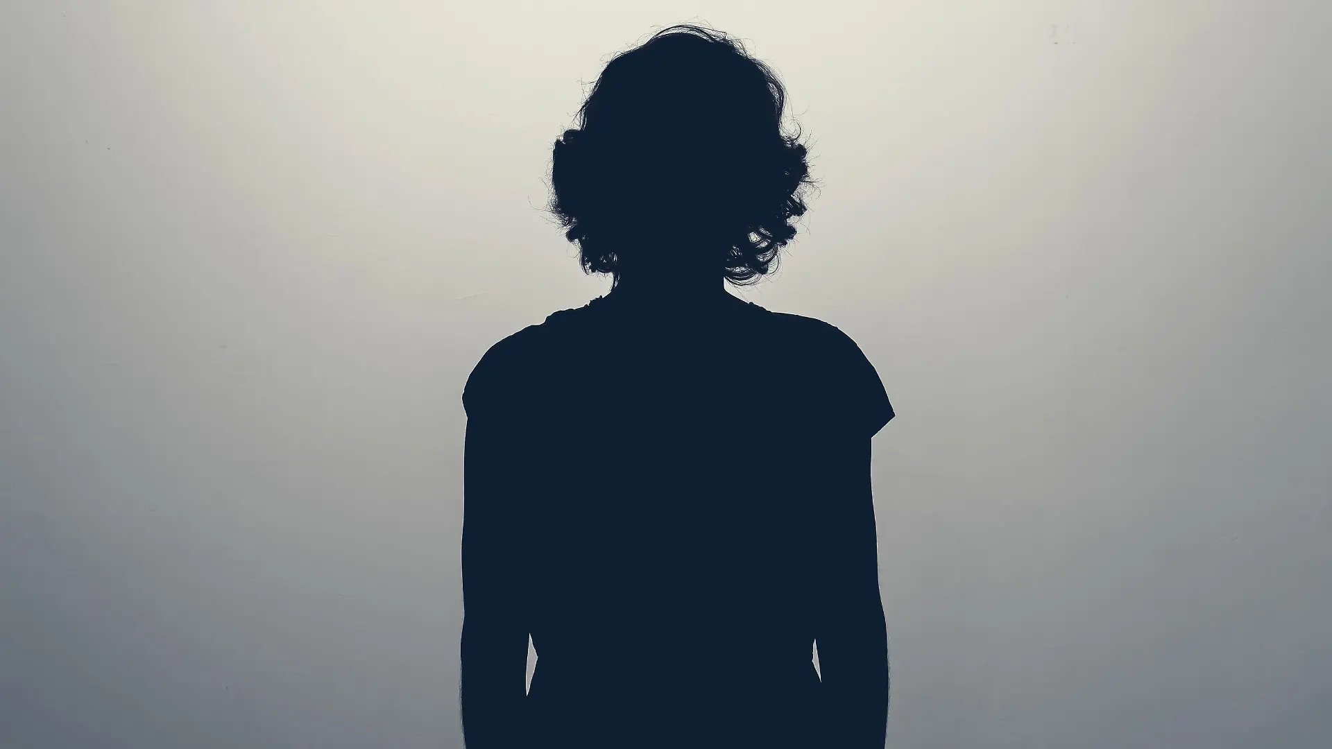 Unknown female person silhouette in studio. Concept of depression, stress or anonymous