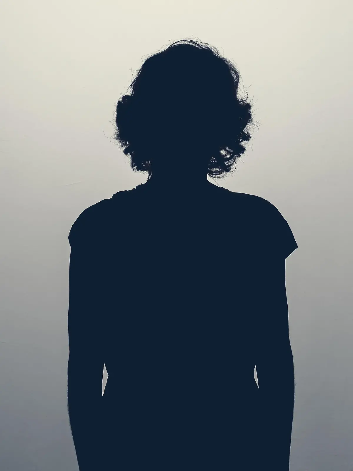 Unknown female person silhouette in studio. Concept of depression, stress or anonymous
