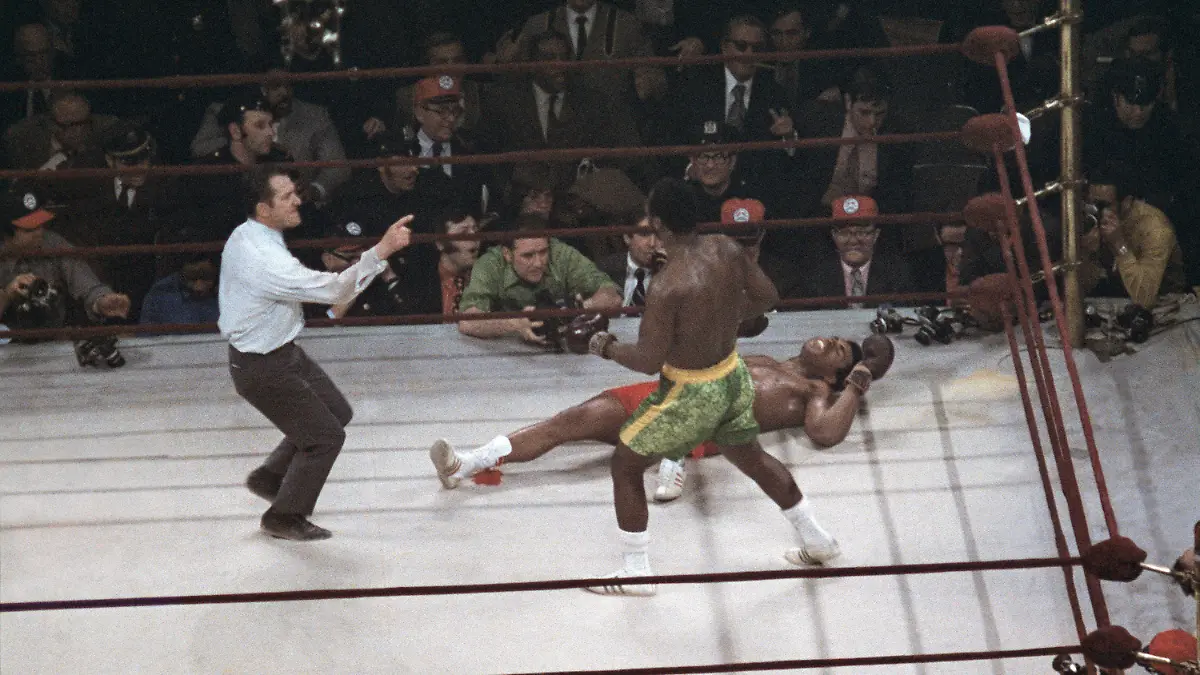 FILE - Joe Frazier stands over Muhammad Ali as referee Art Mercante gestures in the 15th round of their boxing match at Madison Square Garden in New York, in this March 8, 1971, file photo. Frazier was a slight 6-5 favorite in a fight that captivated both the nation and the world. (AP Photo/File)