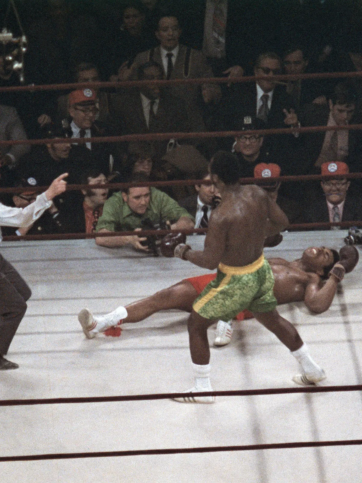 FILE - Joe Frazier stands over Muhammad Ali as referee Art Mercante gestures in the 15th round of their boxing match at Madison Square Garden in New York, in this March 8, 1971, file photo. Frazier was a slight 6-5 favorite in a fight that captivated both the nation and the world. (AP Photo/File)