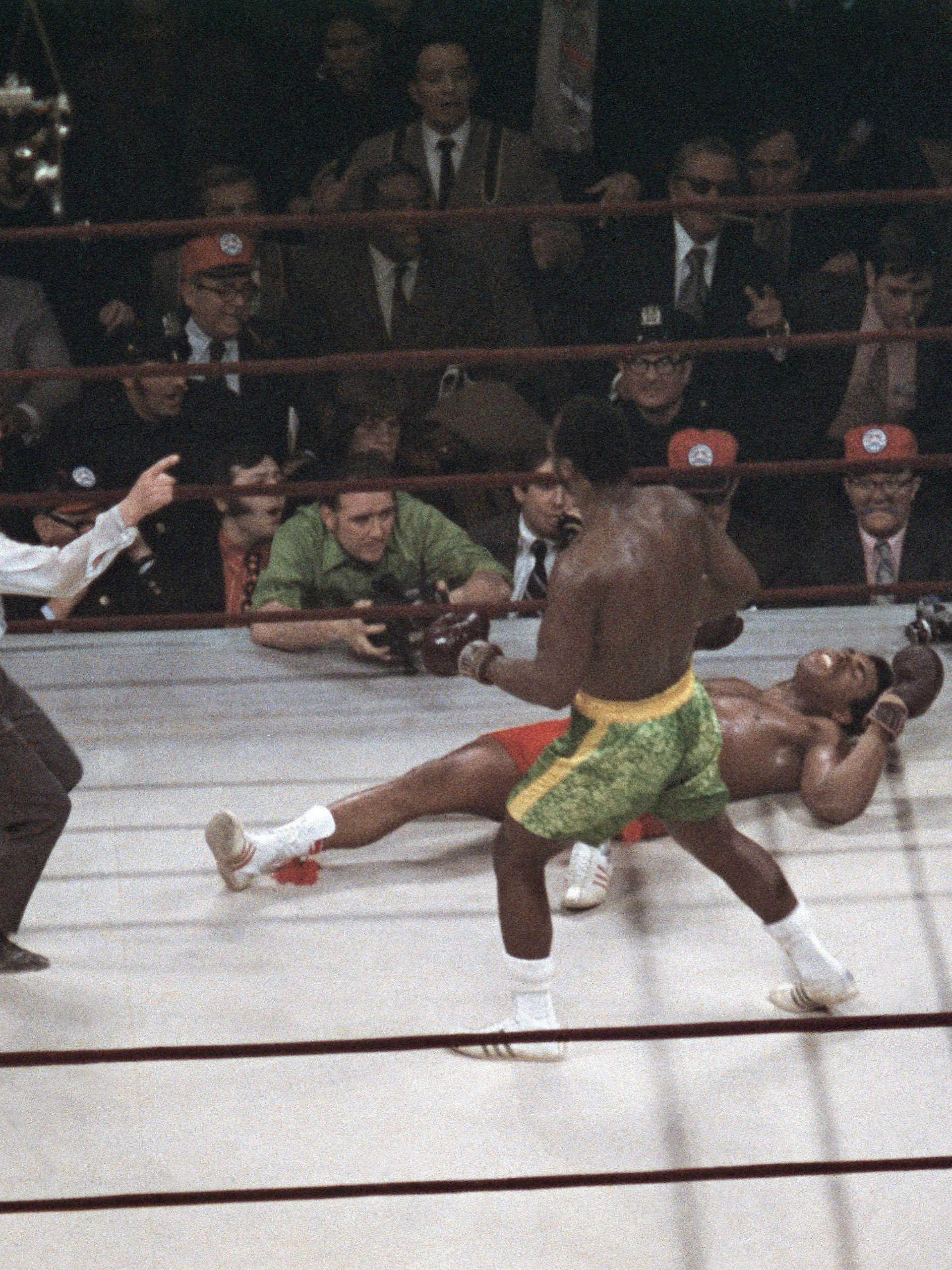 FILE - Joe Frazier stands over Muhammad Ali as referee Art Mercante gestures in the 15th round of their boxing match at Madison Square Garden in New York, in this March 8, 1971, file photo. Frazier was a slight 6-5 favorite in a fight that captivated both the nation and the world. (AP Photo/File)