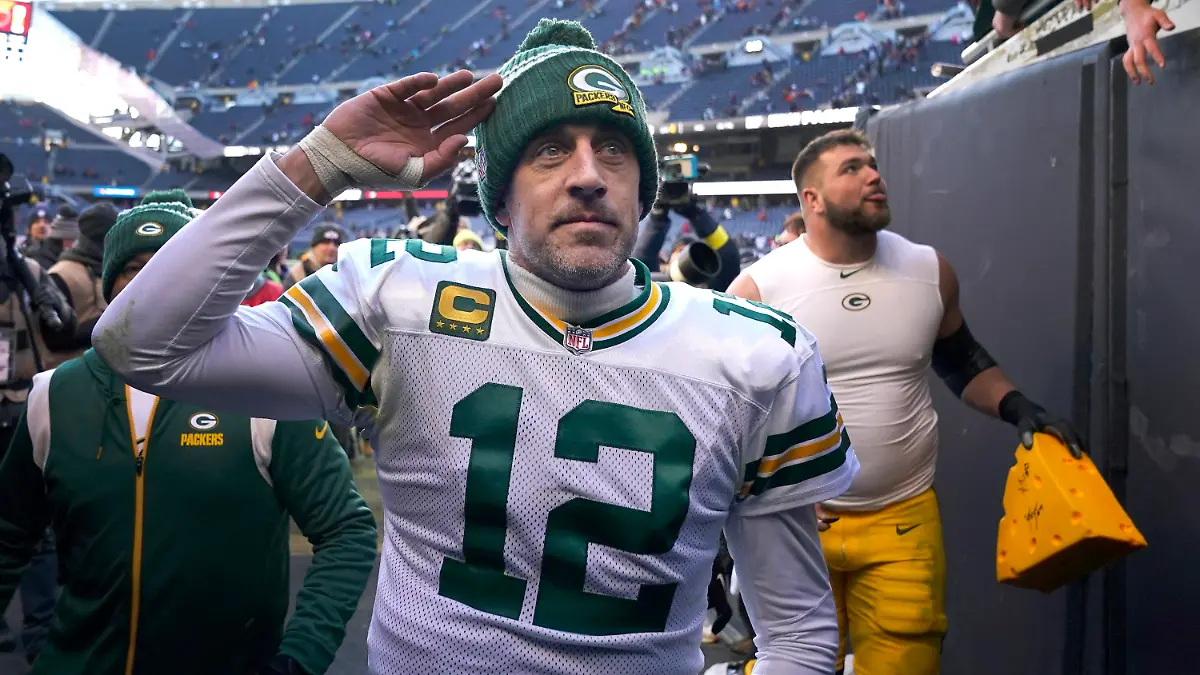 FILE - Green Bay Packers' Aaron Rodgers salutes the fans after an NFL football game against the Chicago Bears, Dec. 4, 2022, in Chicago. Rodgers is leaving behind his brilliant legacy in Green Bay and heading to the bright lights — and massive expectations — of the Big Apple. The New York Jets agreed on a deal Monday, April 24, 2023, to acquire the four-time NFL MVP from the Packers, according to a person with knowledge of the trade. The person spoke to The Associated Press on the condition of anonymity because the teams have not officially announced the deal. (AP Photo/Charles Rex Arbogast, File)