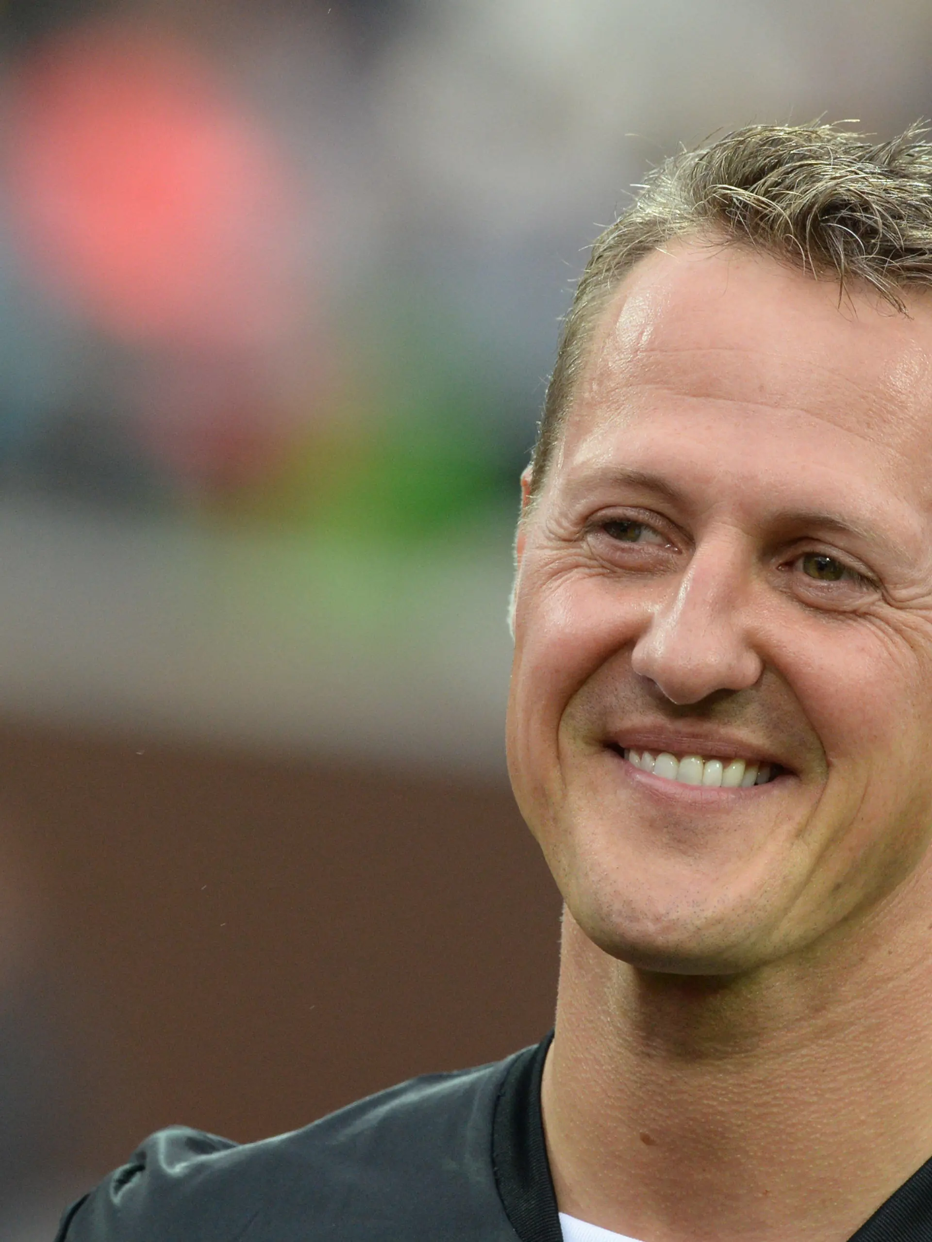 ARCHIV - Der siebenmalige Formel-1-Weltmeister und Schirmherr, Michael Schumacher, steht am 08.09.2013 in Hamburg nach dem «Tag der Legenden» im Millerntor-Stadion in Hamburg. Vier Jahre ist er her. Der Unfall, der das Leben von Michael Schumacher gravierend veränderte. (zu dpa-Meldung: «Momente der Stille: «Wir vermissen Michael Schumacher»» vom 28.12.2017) Foto: Marcus Brandt/dpa +++(c) dpa - Bildfunk+++