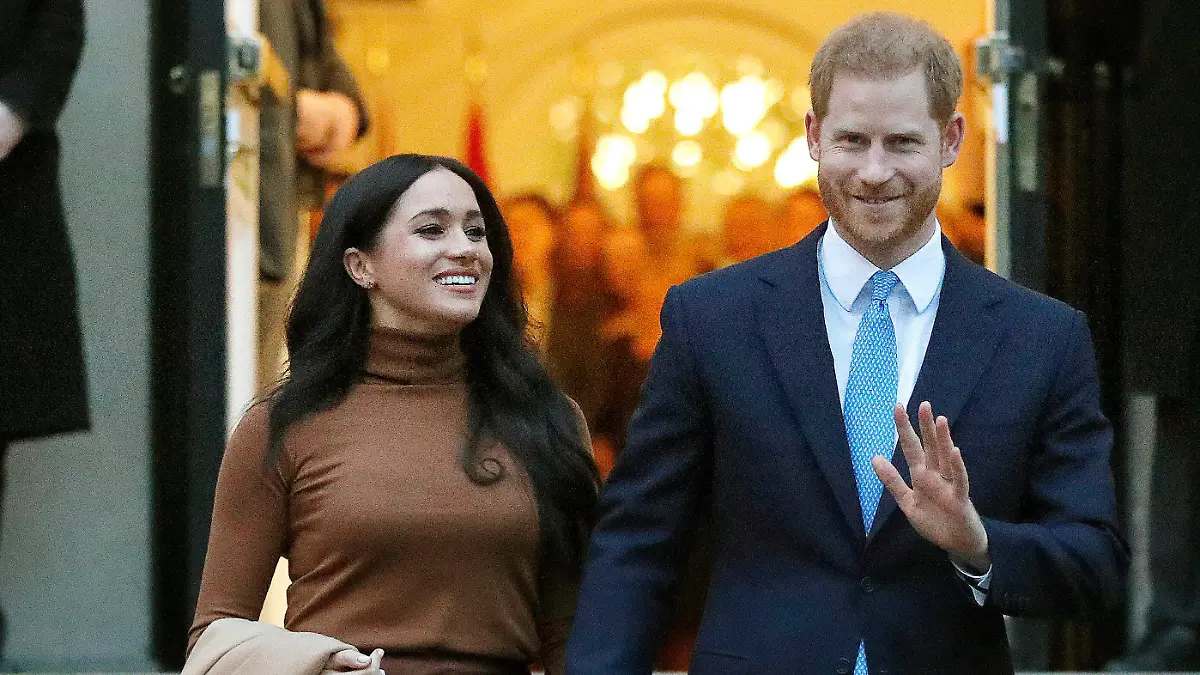 FILE - Prince Harry and Meghan, the Duke and Duchess of Sussex, leave after visiting Canada House on Jan. 7, 2020, in London. Harry and Meghan stepped away from full-time royal life in early 2020, and Buckingham Palace on Friday Feb. 19, 2021, confirmed the couple will not be returning to royal duties, and Harry will give up his honorary military titles. (AP Photo/Frank Augstein, File)