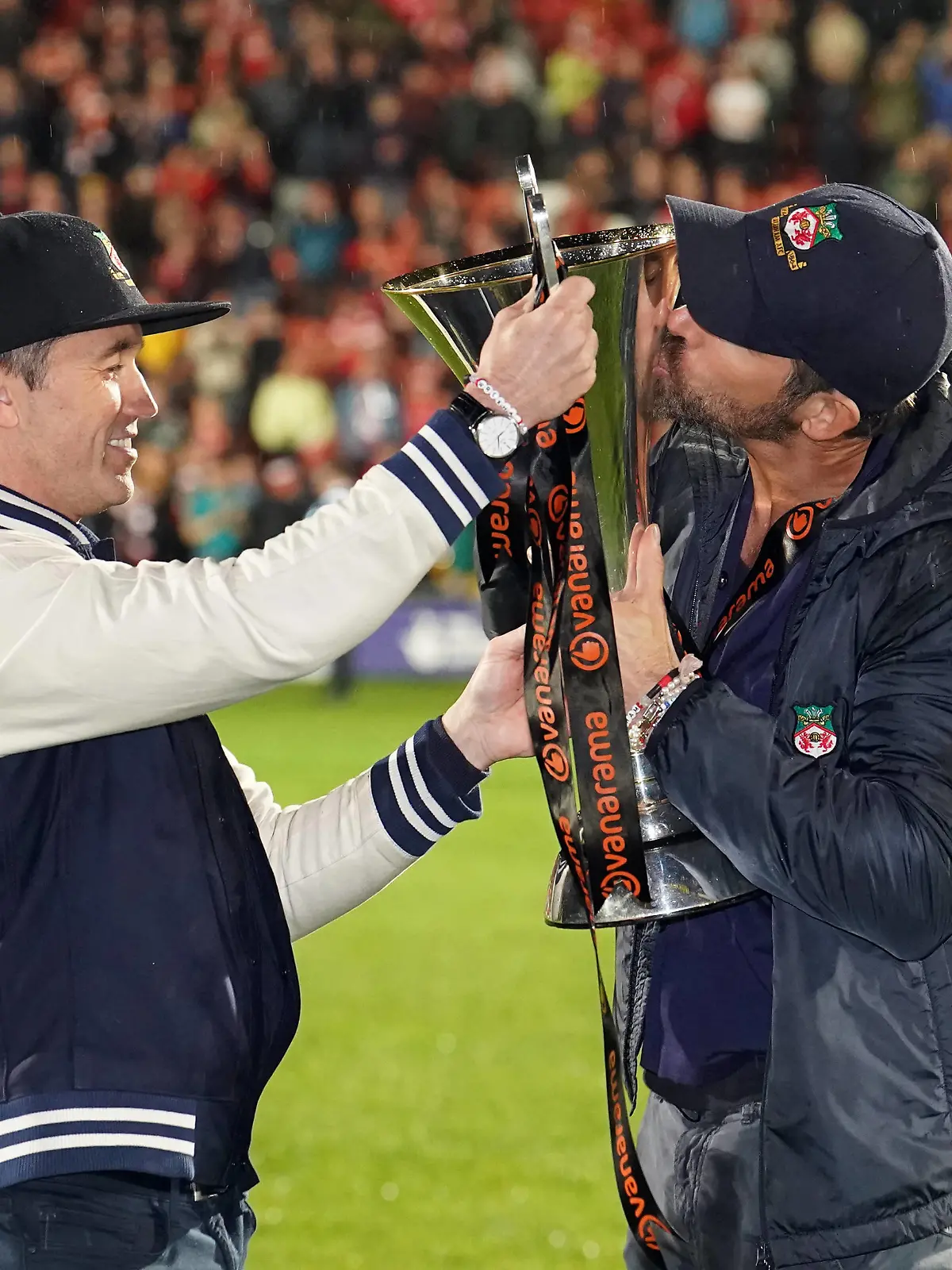 Wrexham v Boreham Wood - Vanarama National League - The Racecourse Ground Wrexham co-owner Rob McElhenney and Ryan Reynolds celebrate with the trophy following promotion to the EFL following the Vanarama National League match at The Racecourse Ground, Wrexham. Picture date: Saturday April 22, 2023. EDITORIAL USE ONLY No use with unauthorised audio, video, data, fixture lists, club/league logos or live services. Online in-match use limited to 120 images, no video emulation. No use in betting, games or single club/league/player publications. PUBLICATIONxNOTxINxUKxIRL Copyright: xMartinxRickettx 71864018