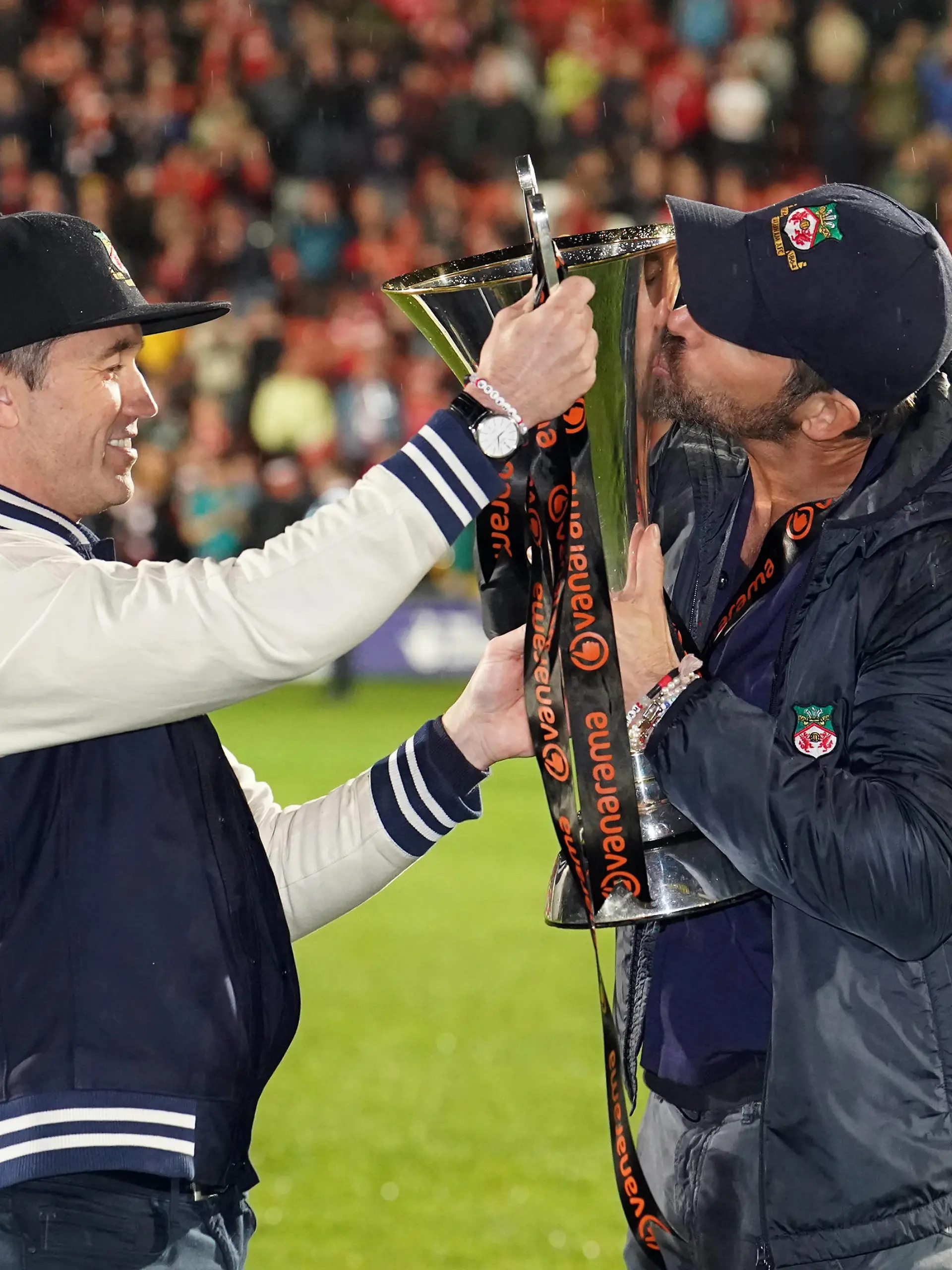 Wrexham v Boreham Wood - Vanarama National League - The Racecourse Ground Wrexham co-owner Rob McElhenney and Ryan Reynolds celebrate with the trophy following promotion to the EFL following the Vanarama National League match at The Racecourse Ground, Wrexham. Picture date: Saturday April 22, 2023. EDITORIAL USE ONLY No use with unauthorised audio, video, data, fixture lists, club/league logos or live services. Online in-match use limited to 120 images, no video emulation. No use in betting, games or single club/league/player publications. PUBLICATIONxNOTxINxUKxIRL Copyright: xMartinxRickettx 71864018