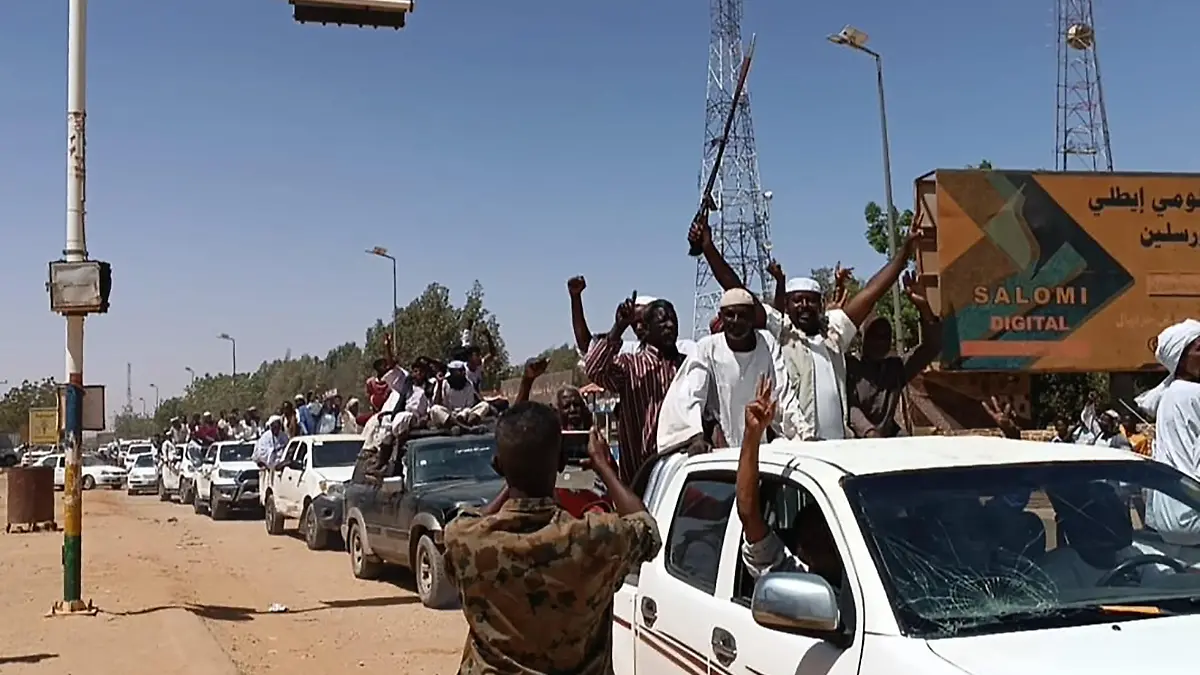 Sudanese supporters and army soldiers, loyal to army chief Abdel Fattah al-Burhan, celebrate after they seized a military base of their rival Rapid Support Forces (RSF) it in Shendi city, Sudan on April 18, 2023. The United Nations says more than 180 people have been killed since the fighting began on Saturday between the Sudanese Armed Forces and the paramilitary Rapid Support Forces (RSF). Photo by Sudanese Armed Forces / UPI Photo via Newscom picture alliance