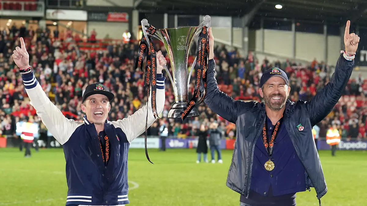 Wrexham v Boreham Wood - Vanarama National League - The Racecourse Ground Wrexham co-owner Rob McElhenney and Ryan Reynolds celebrate with the trophy following promotion to the EFL following the Vanarama National League match at The Racecourse Ground, Wrexham. Picture date: Saturday April 22, 2023. EDITORIAL USE ONLY No use with unauthorised audio, video, data, fixture lists, club/league logos or live services. Online in-match use limited to 120 images, no video emulation. No use in betting, games or single club/league/player publications. PUBLICATIONxNOTxINxUKxIRL Copyright: xMartinxRickettx 71864037