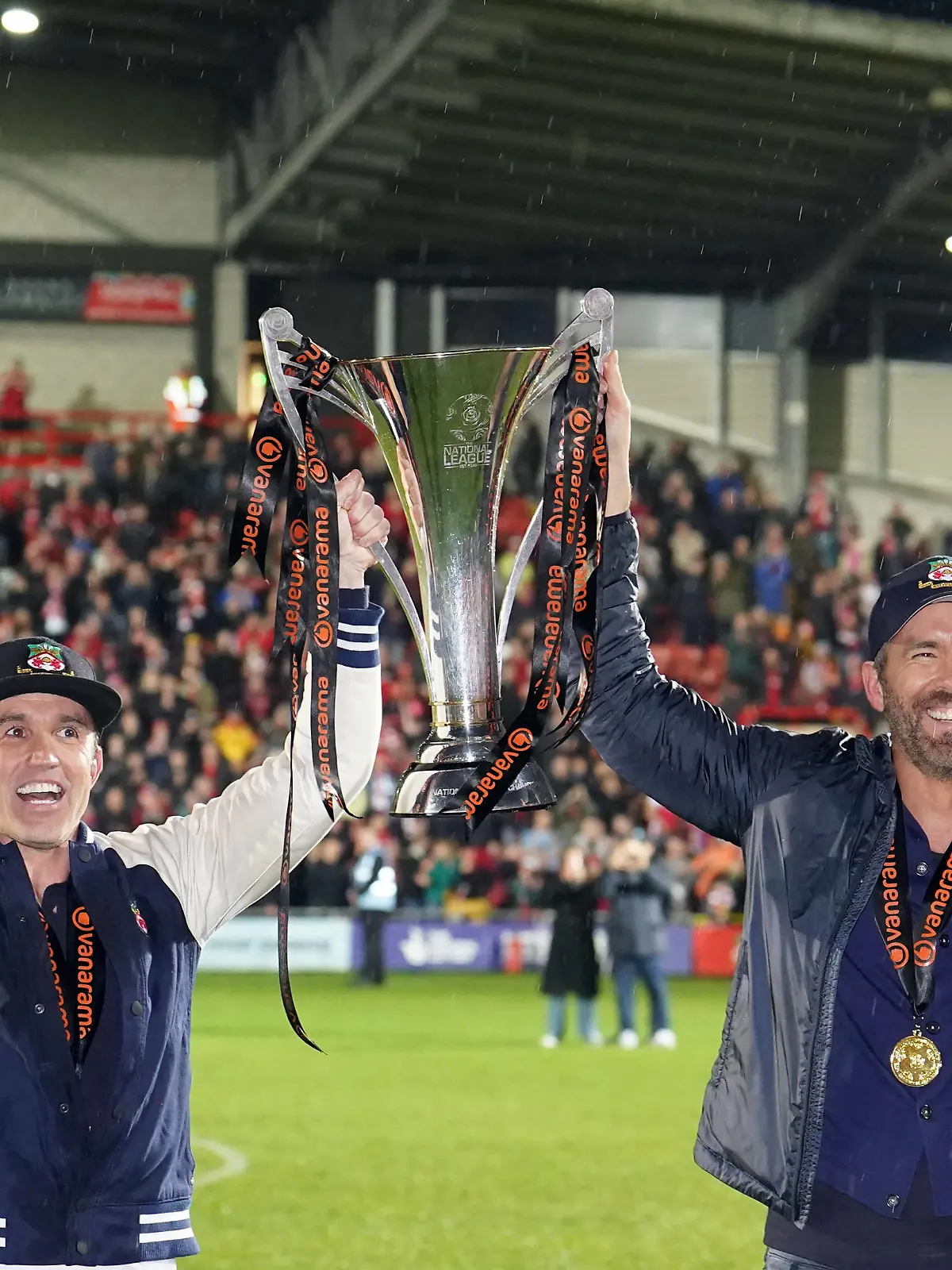 Wrexham v Boreham Wood - Vanarama National League - The Racecourse Ground Wrexham co-owner Rob McElhenney and Ryan Reynolds celebrate with the trophy following promotion to the EFL following the Vanarama National League match at The Racecourse Ground, Wrexham. Picture date: Saturday April 22, 2023. EDITORIAL USE ONLY No use with unauthorised audio, video, data, fixture lists, club/league logos or live services. Online in-match use limited to 120 images, no video emulation. No use in betting, games or single club/league/player publications. PUBLICATIONxNOTxINxUKxIRL Copyright: xMartinxRickettx 71864037