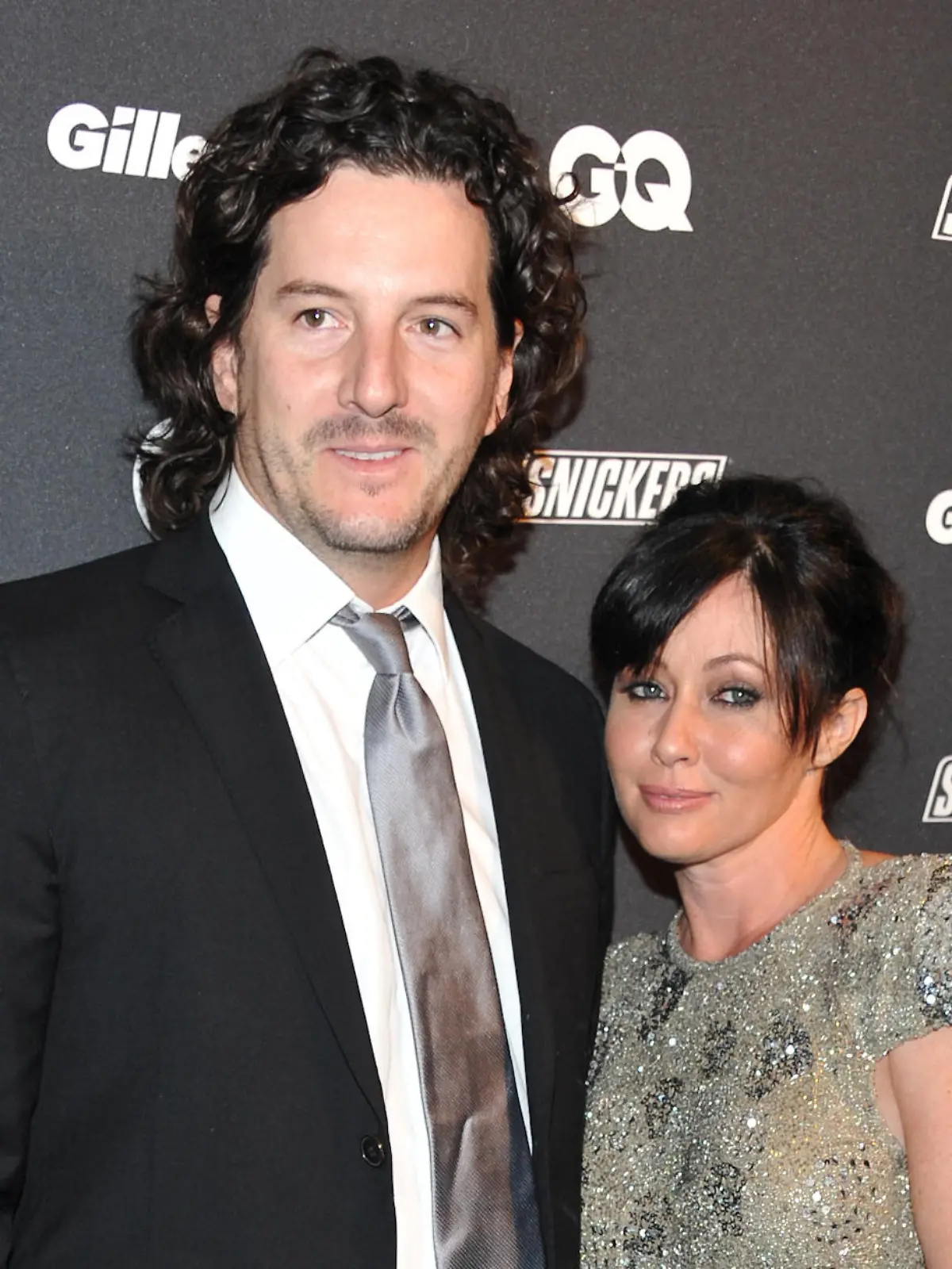 FILE - In this Oct. 27, 2010 file photo, actress Shannen Doherty, right, and Kurt Iswarienko attend 'The Gentleman's Ball' hosted by GQ Magazine at the Edison Ballroom in New York. Doherty and husband Iswarienko sued her former accountants and business managers on Wednesday, Aug. 19, 2015, accusing them of mismanaging her money and causing the cancellation of her health insurance in 2014. The "Beverly Hills 90210" star's lawsuit states Doherty was recently diagnosed with breast cancer and her doctors have told her it worsened during the period when her health insurance had lapsed. (AP Photo/Evan Agostini, File) |