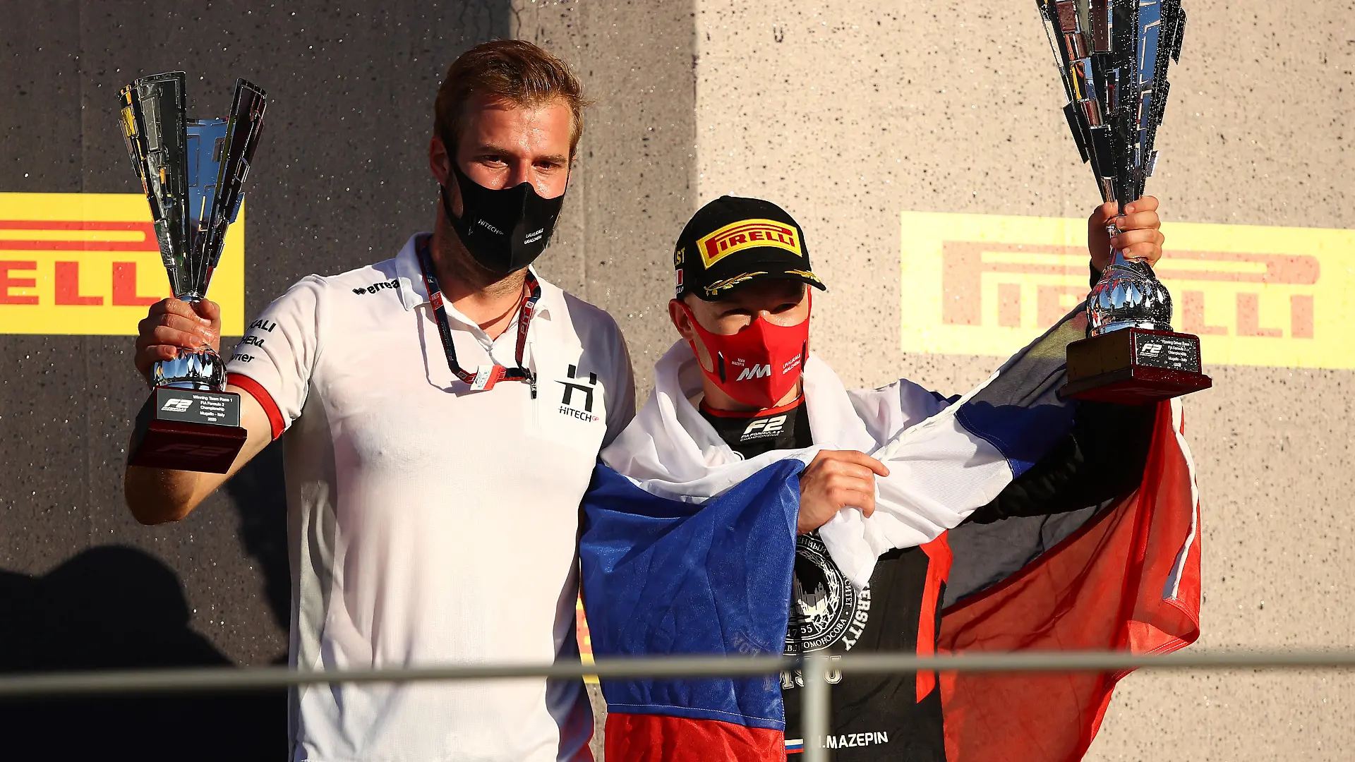 SCARPERIA, ITALY - SEPTEMBER 12: Race winner Nikita Mazepin of Russia and Hitech Grand Prix and Hitech Grand Prix race engineer Jan Sumann celebrate on the podium during the Formula 2 Championship Feature Race at Mugello Circuit on September 12, 2020 in Scarperia, Italy. (Photo by Bryn Lennon/Getty Images)