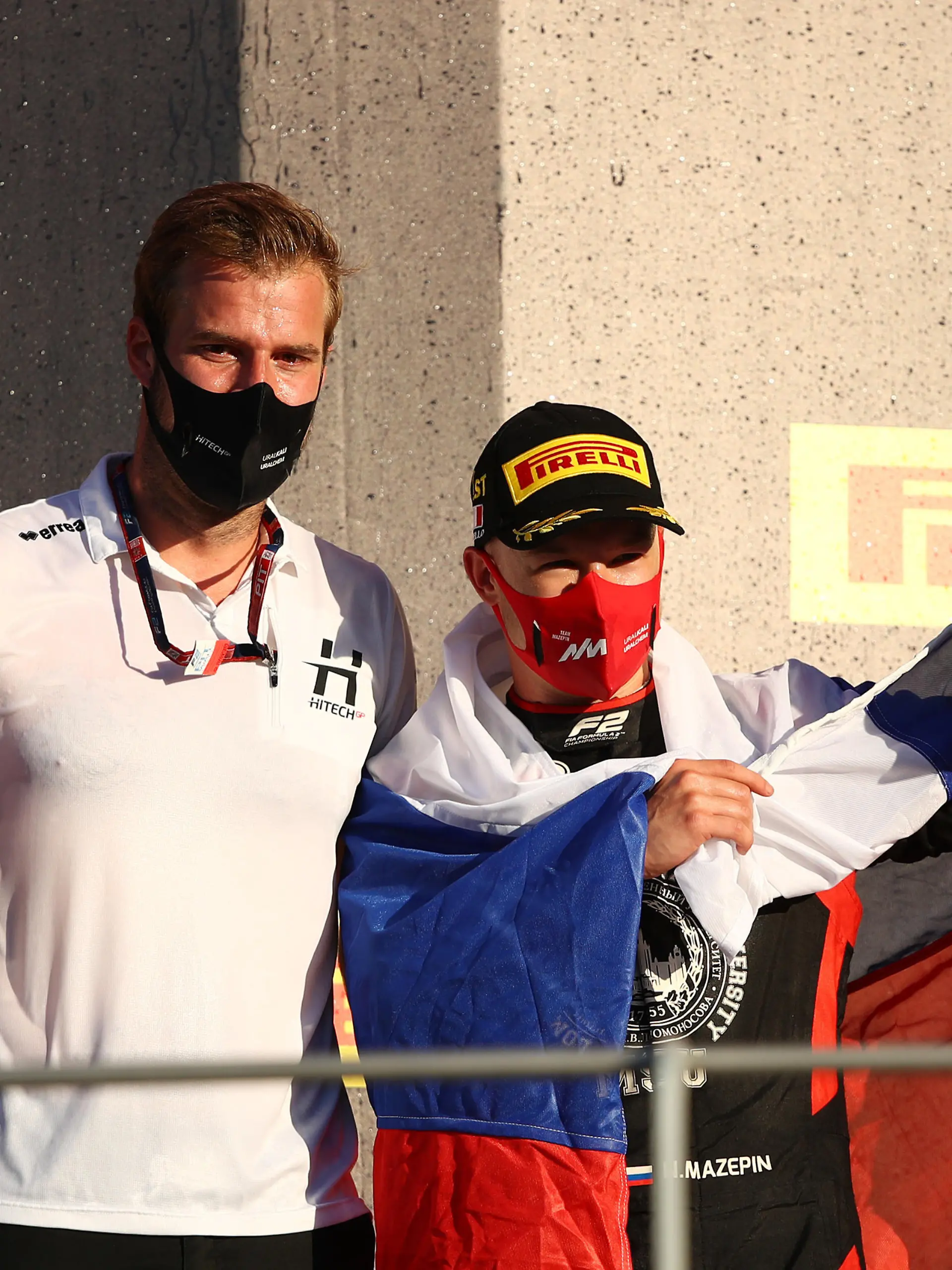 SCARPERIA, ITALY - SEPTEMBER 12: Race winner Nikita Mazepin of Russia and Hitech Grand Prix and Hitech Grand Prix race engineer Jan Sumann celebrate on the podium during the Formula 2 Championship Feature Race at Mugello Circuit on September 12, 2020 in Scarperia, Italy. (Photo by Bryn Lennon/Getty Images)