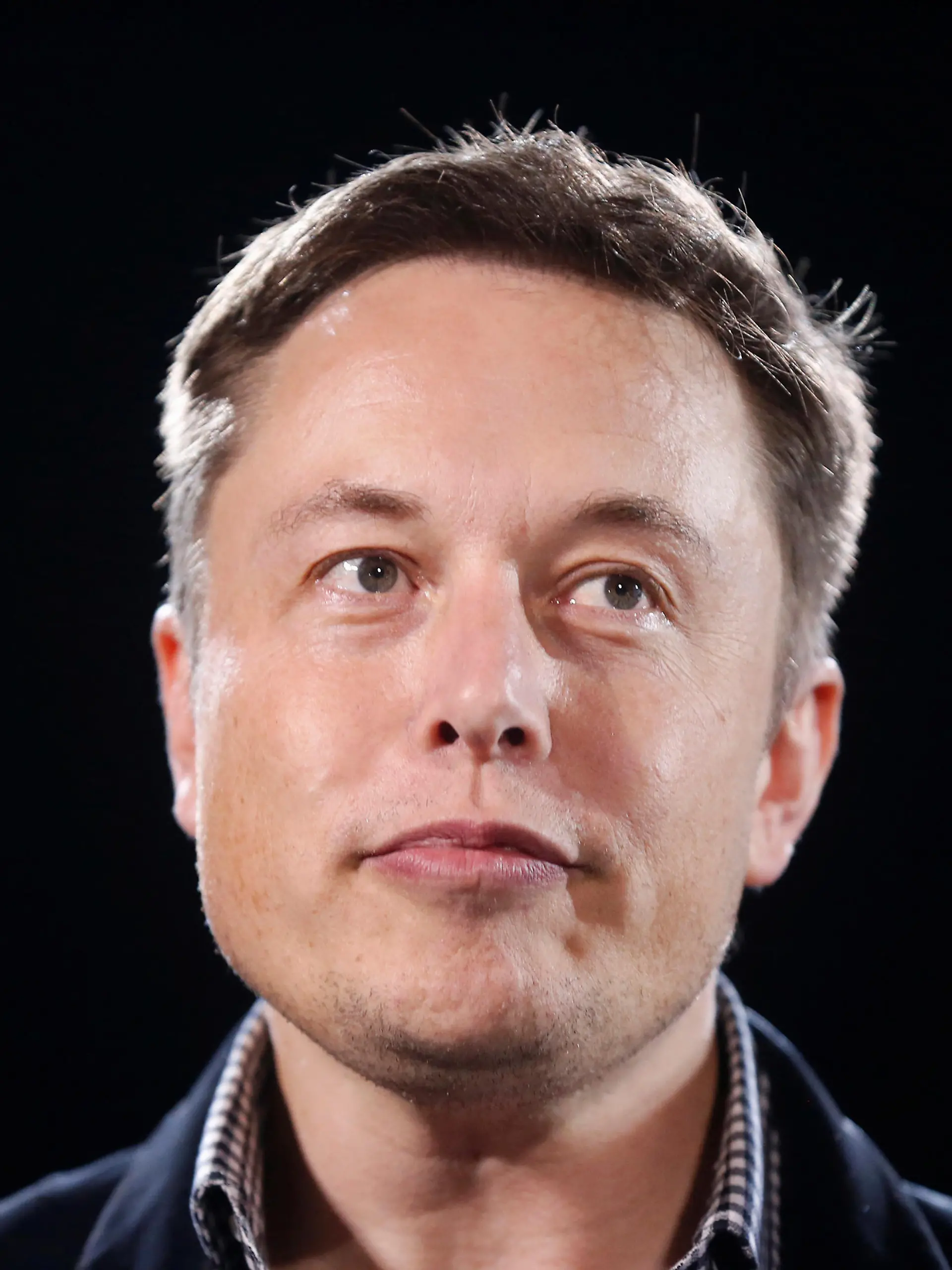 FILE PHOTO: Tesla Motors Inc CEO Elon Musk unveils a new all-wheel-drive version of the Model S car in Hawthorne, California October 9, 2014. REUTERS/Lucy Nicholson/File Photo