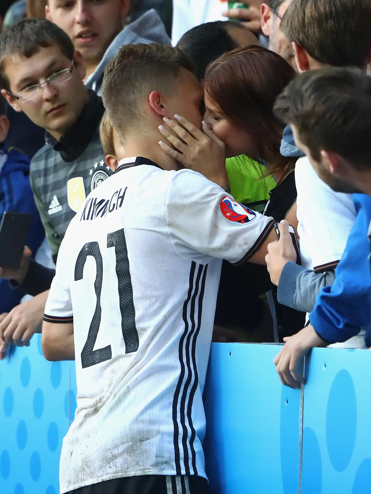 LILLE, FRANCE - JUNE 26:  Joshua Kimmich of Germany kisses his girlfriend Lina Meyer after the UEFA EURO 2016 round of 16 match between Germany and Slovakia at Stade Pierre-Mauroy on June 26, 2016 in Lille, France.  (Photo by Alexander Hassenstein/Getty Images)