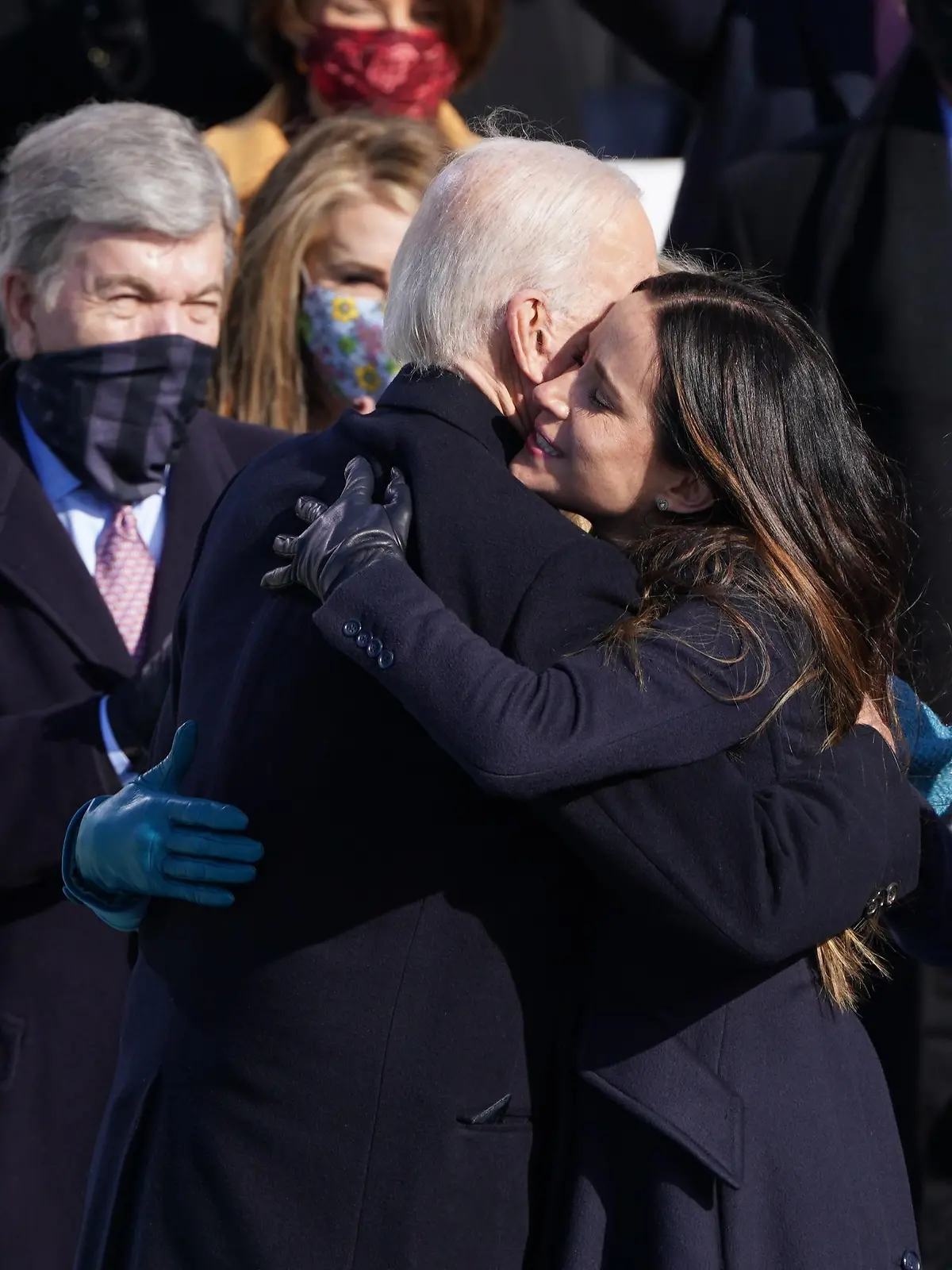 U.S. President Joe Biden embraces his daughter Ashley Biden after he was sworn in as the 46th President of the United States on the West Front of the U.S. Capitol in Washington, U.S., January 20, 2021. REUTERS/Kevin Lamarque