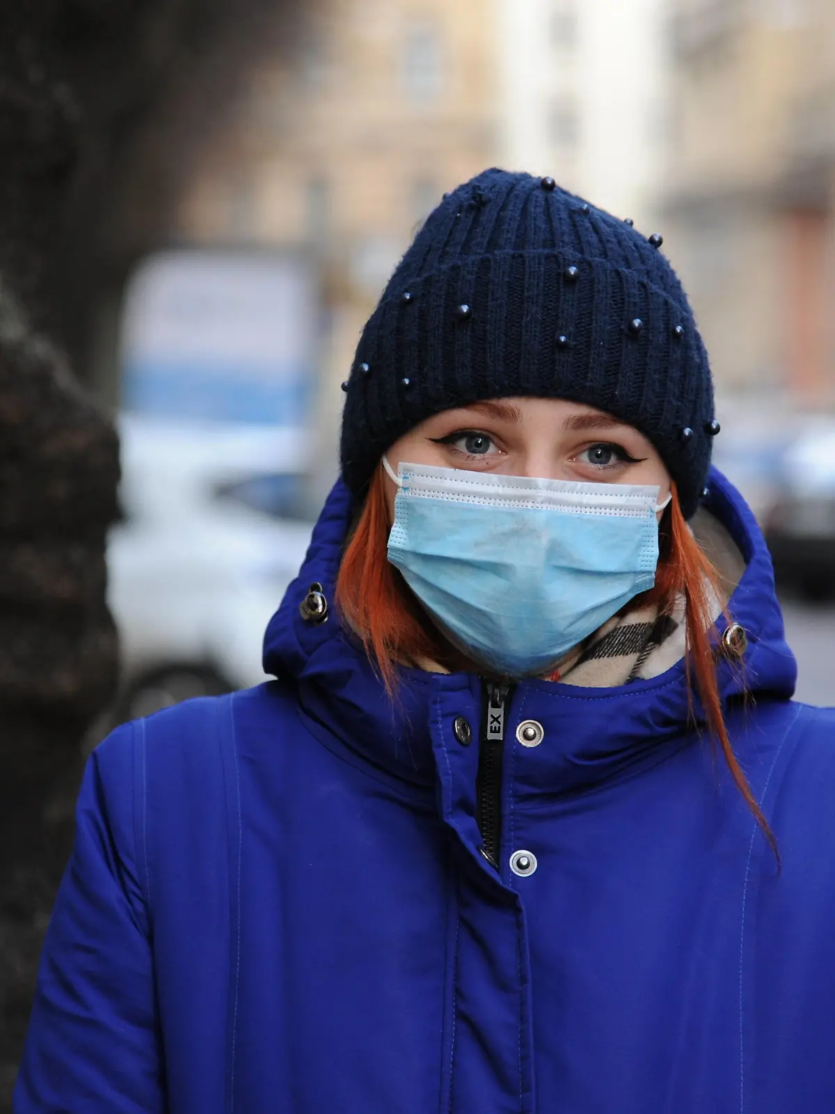  December 7, 2020, Lviv, Ukraine: A woman looks on while wearing a mask as a preventive measure against the spread of covid-19. Lviv Ukraine - ZUMAs197 20201207_zaa_s197_022 Copyright: xMykolaxTysx