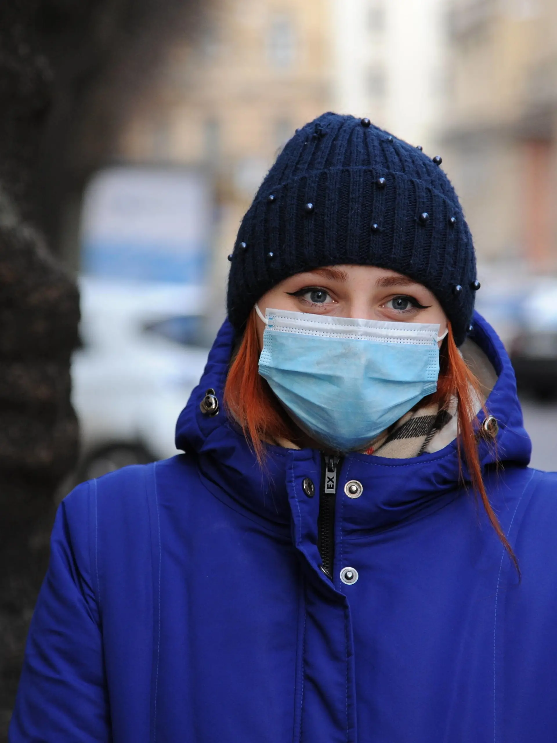  December 7, 2020, Lviv, Ukraine: A woman looks on while wearing a mask as a preventive measure against the spread of covid-19. Lviv Ukraine - ZUMAs197 20201207_zaa_s197_022 Copyright: xMykolaxTysx