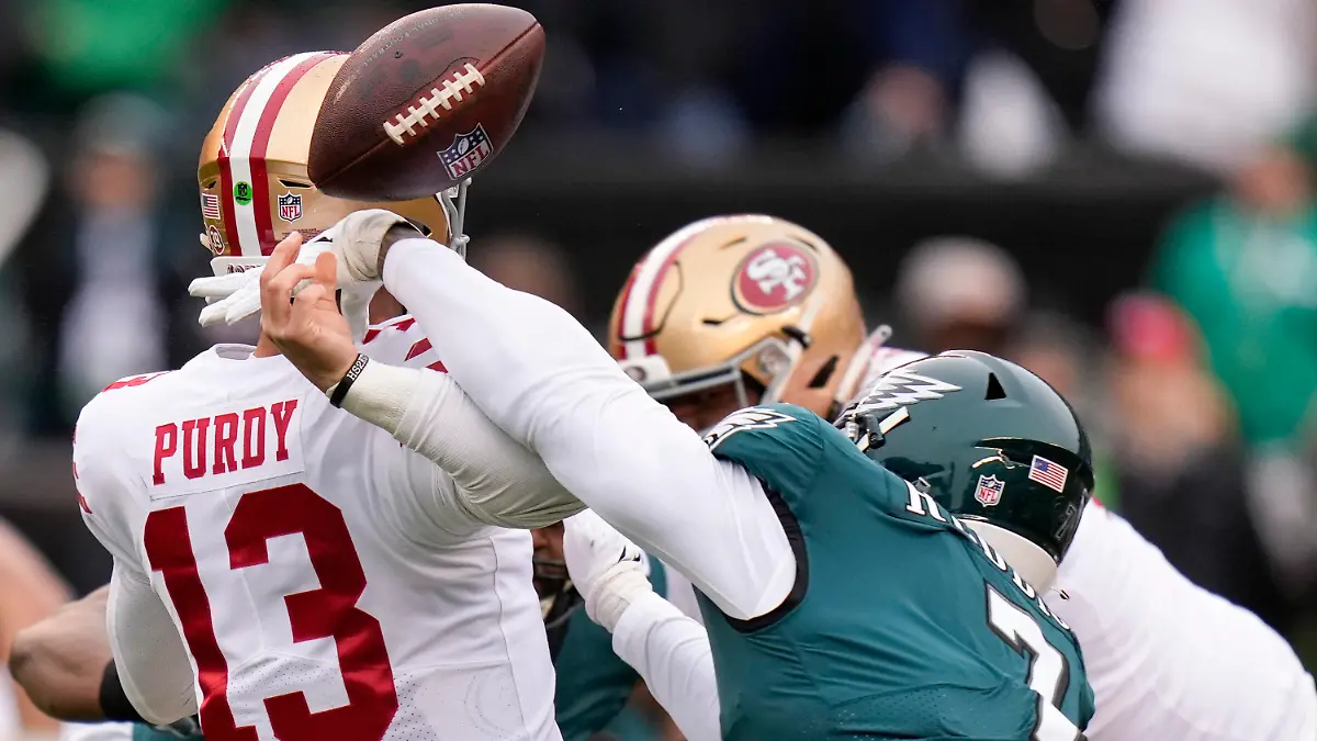 Philadelphia Eagles linebacker Haason Reddick, right, causes a fumble by San Francisco 49ers quarterback Brock Purdy during the first half of the NFC Championship NFL football game between the Philadelphia Eagles and the San Francisco 49ers on Sunday, Jan. 29, 2023, in Philadelphia. (AP Photo/Seth Wenig)