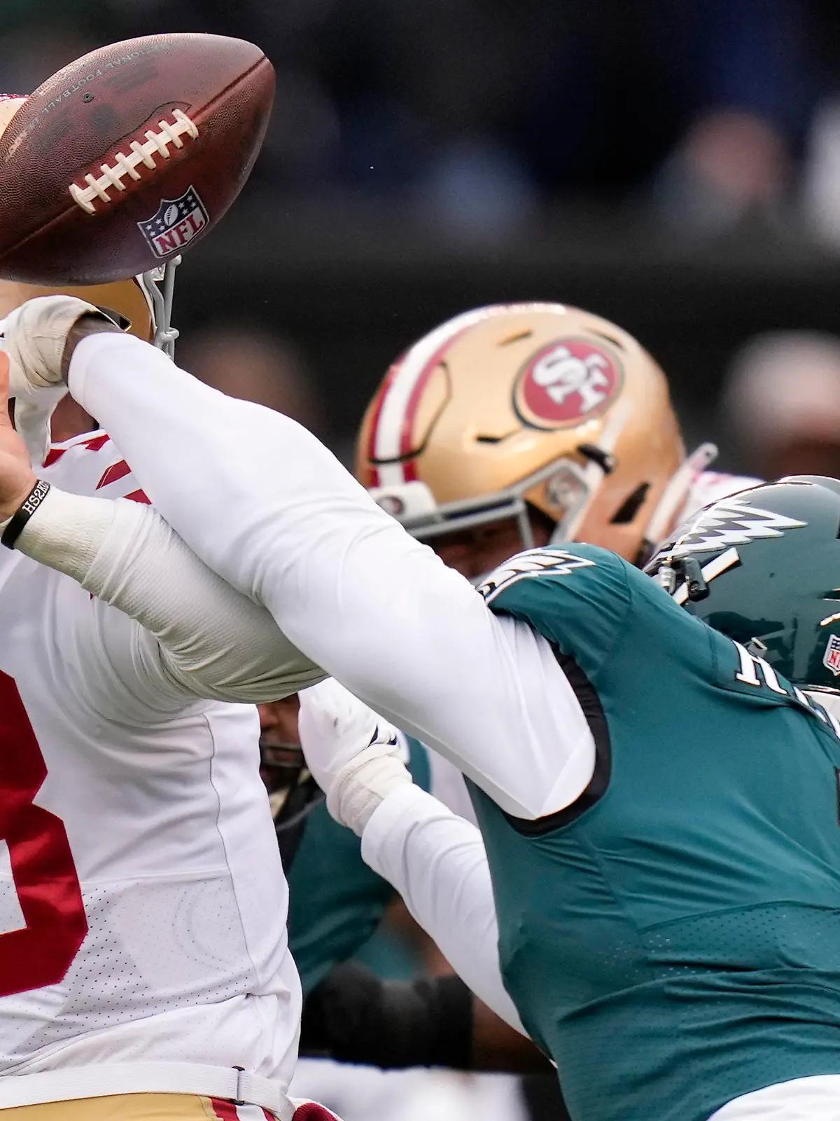 Philadelphia Eagles linebacker Haason Reddick, right, causes a fumble by San Francisco 49ers quarterback Brock Purdy during the first half of the NFC Championship NFL football game between the Philadelphia Eagles and the San Francisco 49ers on Sunday, Jan. 29, 2023, in Philadelphia. (AP Photo/Seth Wenig)