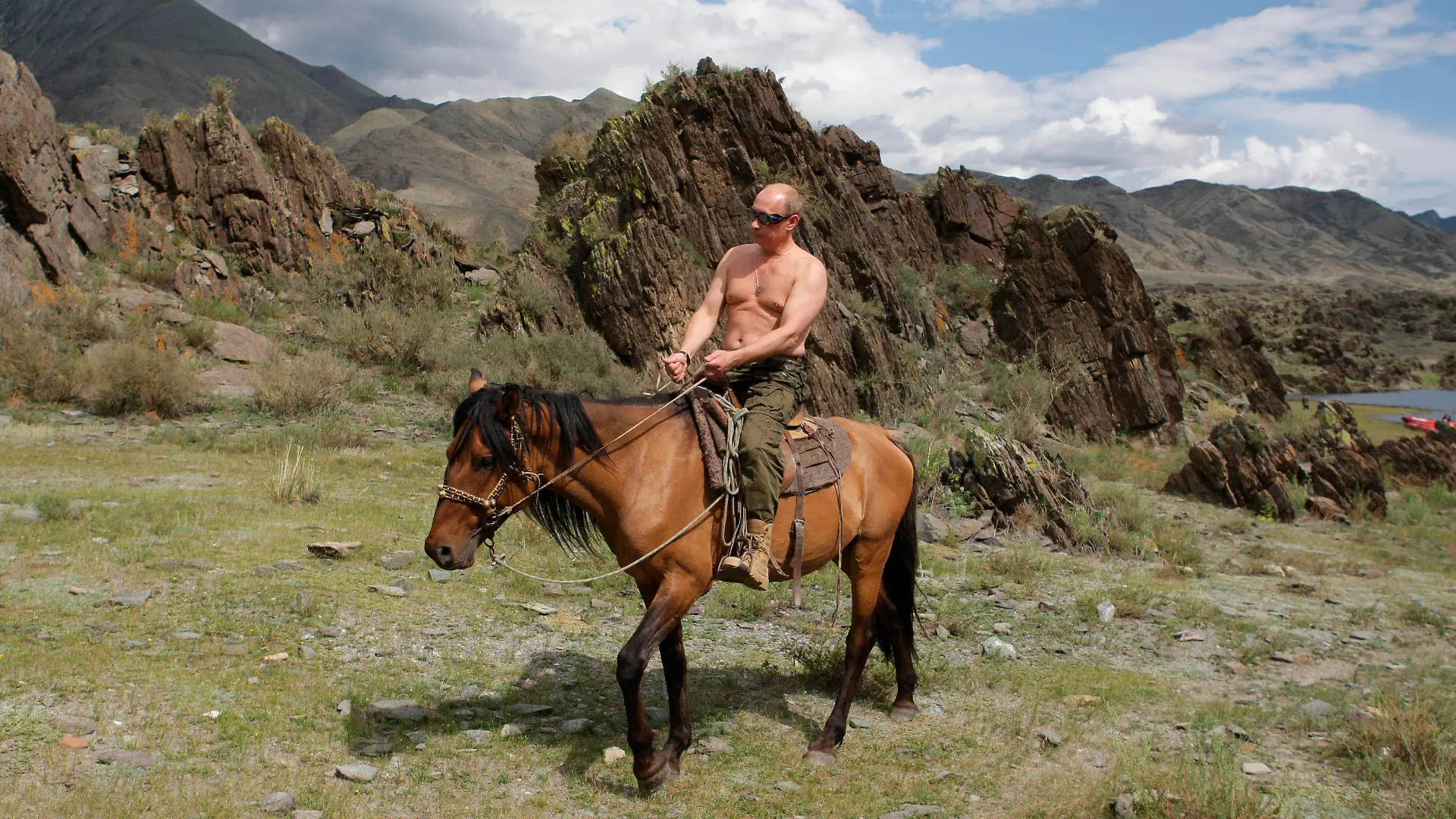 FILE - In this file pool photo taken on Monday, Aug. 3, 2009, the then Russian Prime Minister Vladimir Putin ia seen riding a horse while traveling in the mountains of the Siberian Tyva region (also referred to as Tuva), Russia, during his short vacation. After 18 years as Russia’s leader _ and with another six-year term sure to follow a March election _ Putin doesn’t show the appetites or vulnerabilities that can personalize Western politics, even when staged or spun. If he has moments of merriment or melancholy, they happen in private. (Alexei Druzhinin, Sputnik, Kremlin Pool Photo via AP, file)