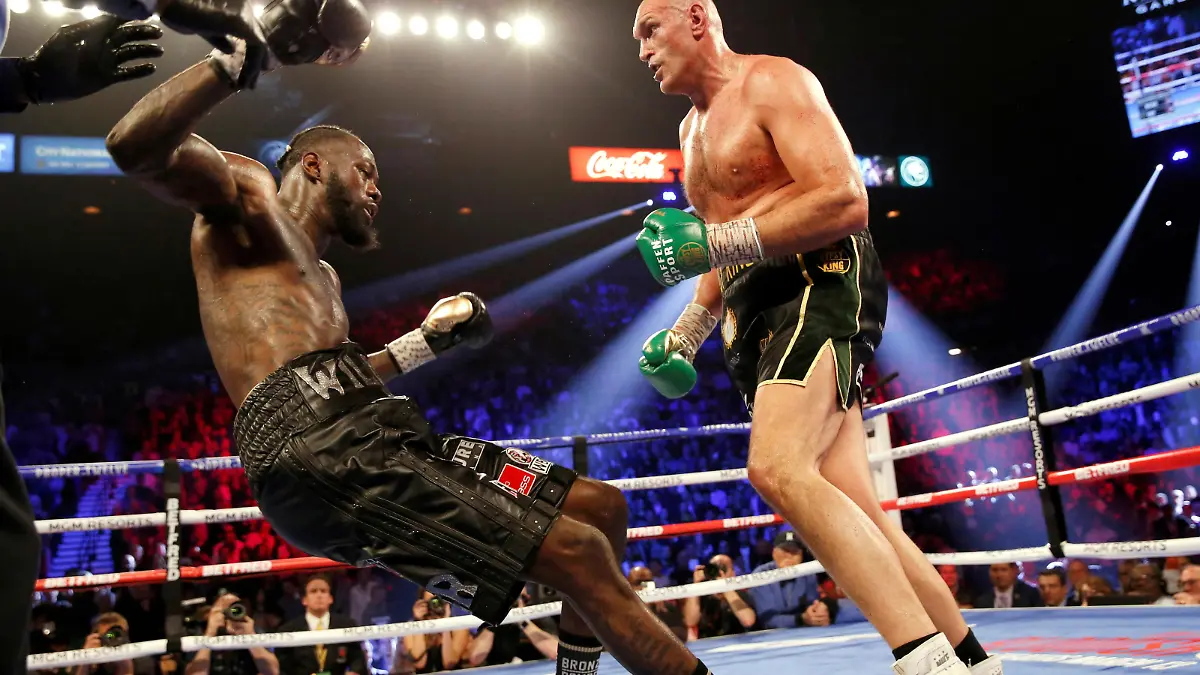 Boxing - Deontay Wilder v Tyson Fury - WBC Heavyweight Title - The Grand Garden Arena at MGM Grand, Las Vegas, United States - February 22, 2020 Tyson Fury knocks down Deontay Wilder during the fight REUTERS/Steve Marcus/File Photo     TPX IMAGES OF THE DAY     SEARCH "POY SPORTS" FOR THIS STORY. SEARCH "REUTERS POY" FOR ALL BEST OF 2020 PACKAGES