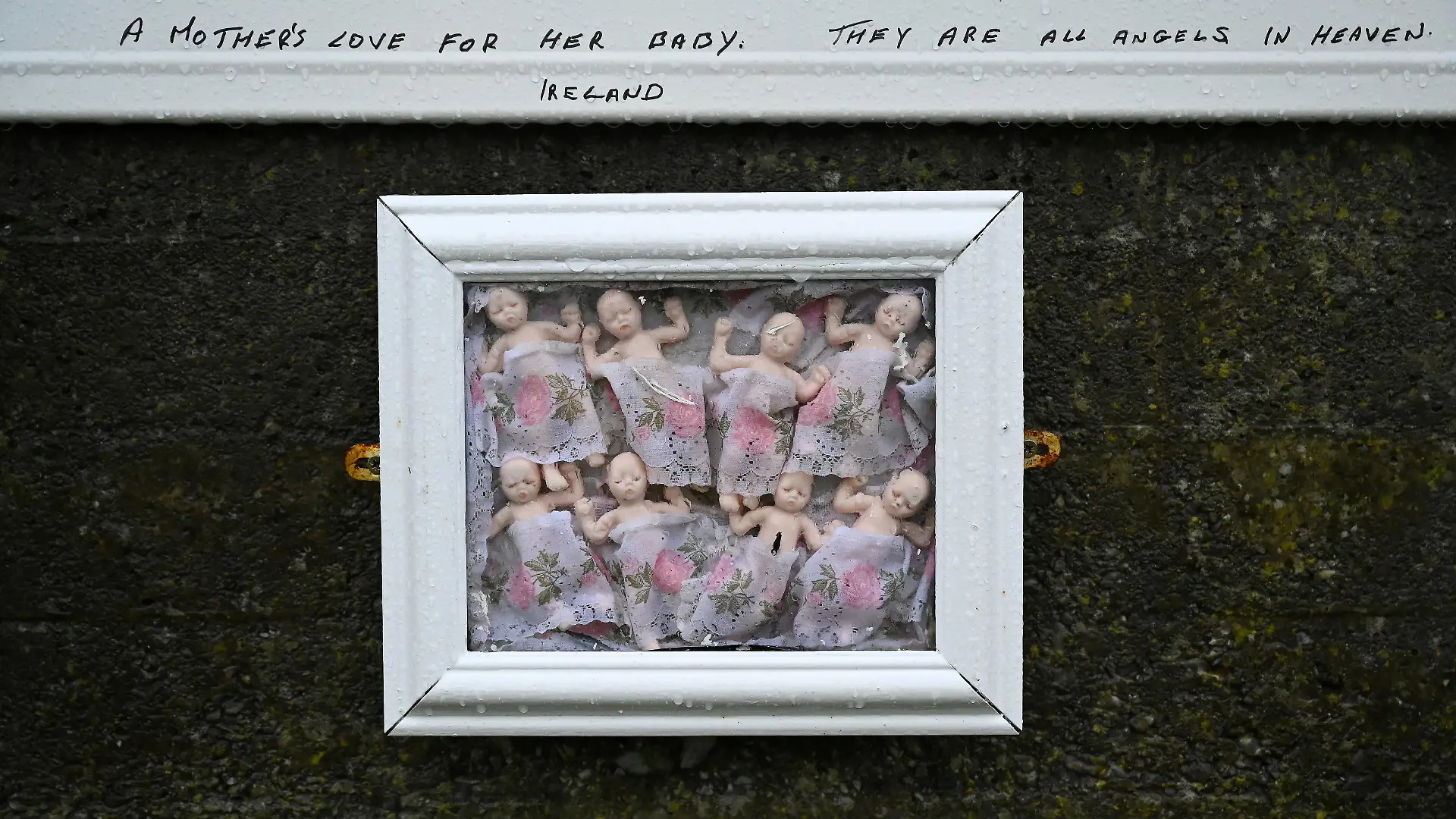 A detail view of the Tuam graveyard, where the bodies of 796 babies were uncovered at the site of a former Catholic home for unmarried mothers and their children on the day a government-ordered inquiry into former Church-run homes for unmarried mothers is formally published, in Tuam, Ireland, January 12, 2021. REUTERS/Clodagh Kilcoyne TPX IMAGES OF THE DAY
