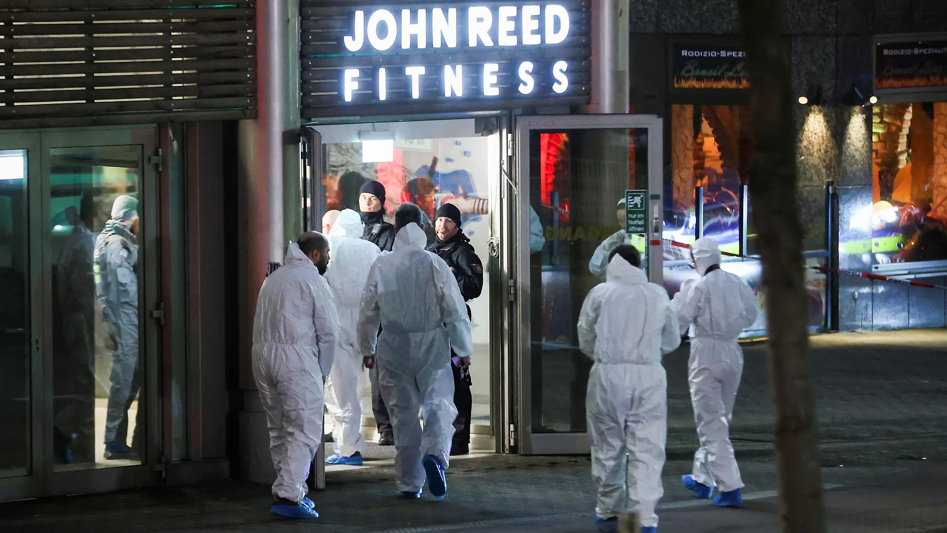 Forensics personnel secure the area after a man seriously injured at least four people with a knife at a fitness studio, in Duisburg, Germany, April 18, 2023. REUTERS/Thilo Schmuelgen