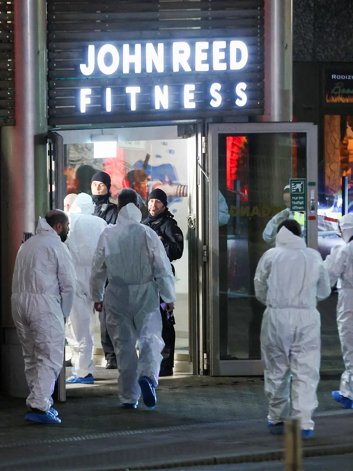 Forensics personnel secure the area after a man seriously injured at least four people with a knife at a fitness studio, in Duisburg, Germany, April 18, 2023. REUTERS/Thilo Schmuelgen