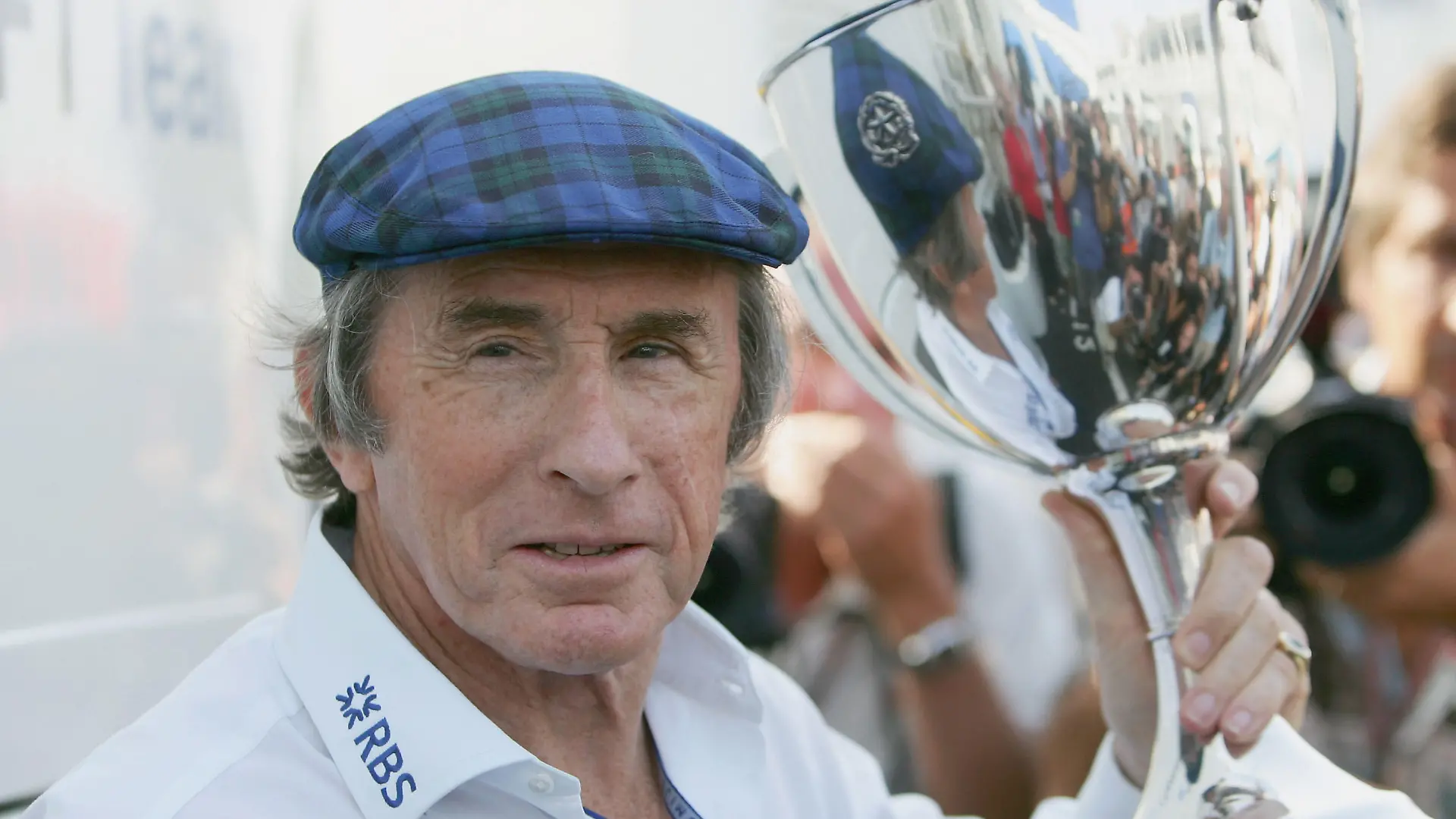 MONZA, ITALY - SEPTEMBER 04: Sir Jackie Stewart poses for photographs with his winners trophy from the 1965 Italian Grand Prix at Monza prior to the Italian Grand Prix at the Autodromo Nationale di Monza circuit on September 4, 2005 in Monza, Italy. (Photo by Mark Thompson/Getty Images)