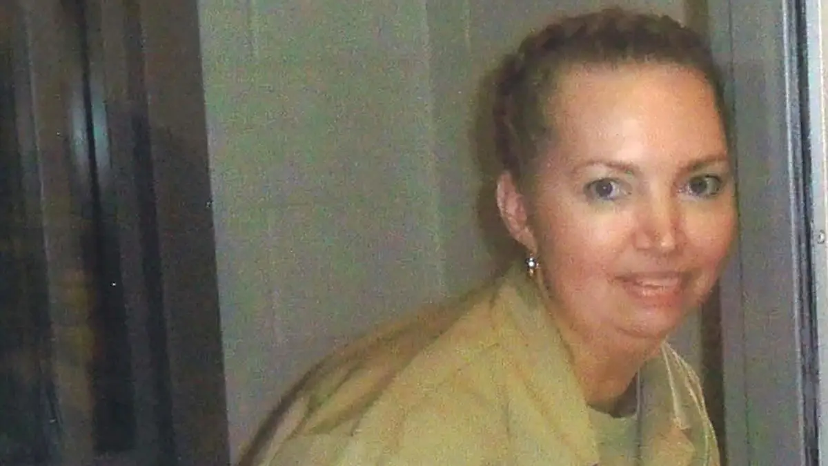 FILE PHOTO: Lisa Montgomery, a federal prison inmate scheduled for execution on December 8, 2020, poses at the Federal Medical Center (FMC) Fort Worth in an undated photograph. Courtesy of Attorneys for Lisa Montgomery/Handout via REUTERS./File Photo
