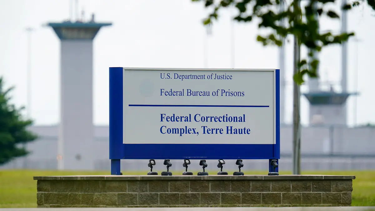 FILE - This Aug. 28, 2020, file photo shows the federal prison complex in Terre Haute, Ind.   (AP Photo/Michael Conroy, File)A federal judge said the Justice Department unlawfully rescheduled the execution of the only woman on federal death row, potentially setting up the Trump administration to schedule the execution after president-elect Joe Biden takes office. U.S. District Court Judge Randolph Moss also vacated an order from the director of the Bureau of Prisons that had set Lisa Montgomery’s execution date for Jan. 12, 2021.  (AP Photo/Michael Conroy)