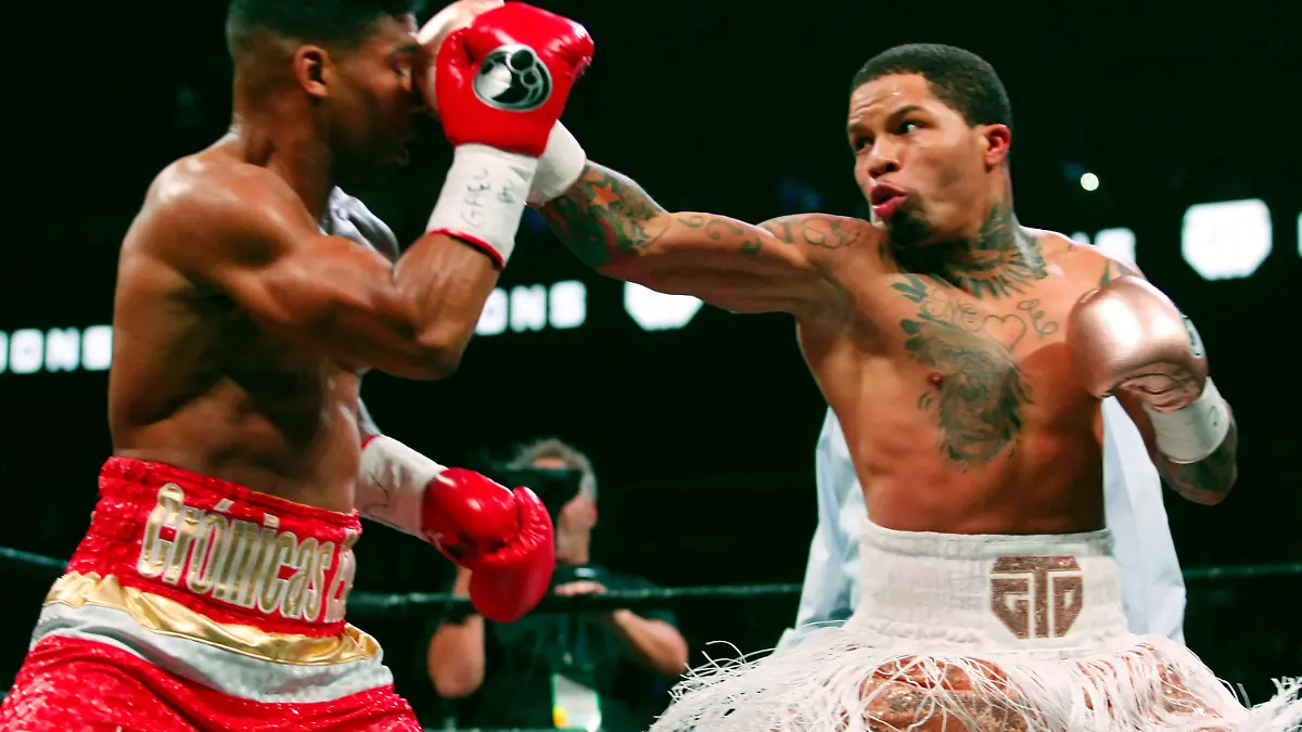 FILE - In this Dec. 29, 2019, file photo, Gervonta Davis, right, lands a punch on Yuriorkis Gamboa during round eight in their WBA lightweight bout in Atlanta. Davis wants to become a pay-per-view star, much like his promoter and mentor Floyd Mayweather Jr. was in his prime. He also wants to fight in front of a lot of screaming fans, though he’ll have to settle for a pandemic-limited audience of ticket holders Saturday in San Antonio for his title matchup with veteran Leo Santa Cruz. (AP Photo/Tami Chappell, File)